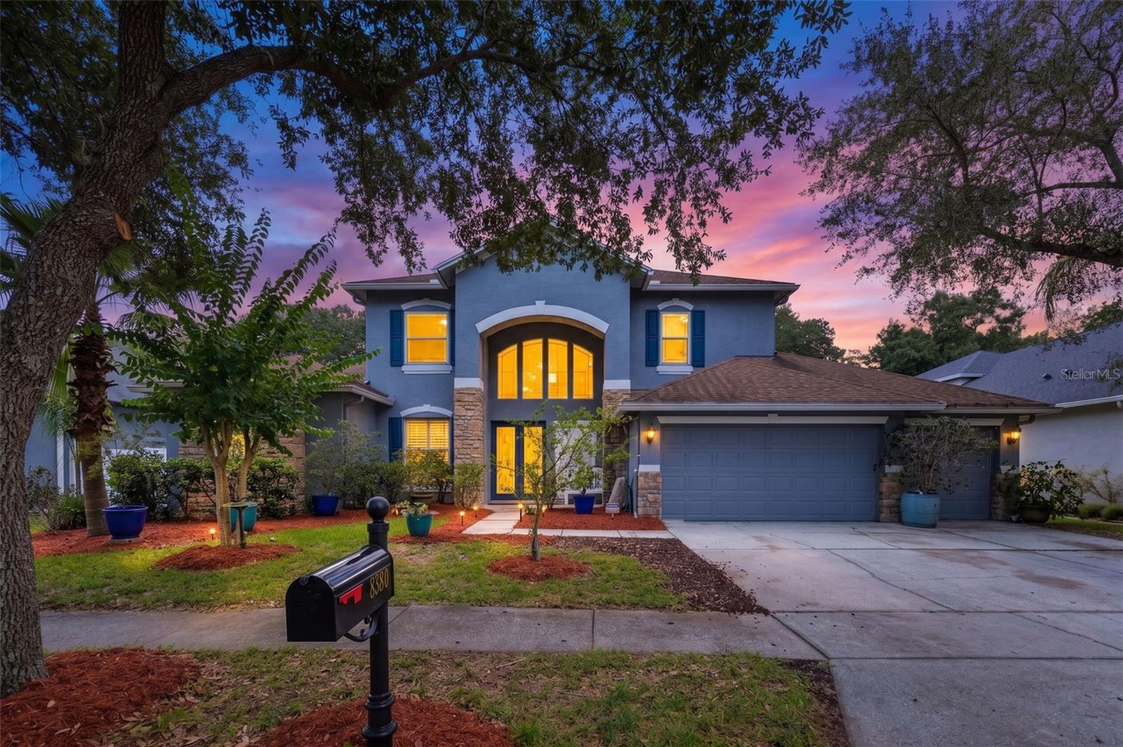WEST MEADOWS - HAWTHORNE ESTATES! Spacious 5 bedroom /4.5 bath home with 3-car garage, dedicated office, and pool & spa backing to peaceful conservation views - NO REAR NEIGHBORS! Enjoy quiet mornings or lively weekends on the screened lanai with outdoor kitchen and room to relax or entertain. Inside, the updated kitchen features quartz counters, stainless appliances, built-in pantry wall and a bright breakfast nook open to the family room with a cozy fireplace: your perfect everyday gathering space.  The downstairs primary suite offers comfort and privacy with dual walk-in closets, dual vanities, a soaking tub, and separate shower. Upstairs, you’ll find four spacious bedrooms and two full baths, providing flexible space for family and guests. A backyard shed (3 years old) adds convenience and extra storage.  Set within one of New Tampa’s premier communities, residents enjoy a lap pool, resort-style pool with water slide, tennis, pickleball, and basketball courts, two dog parks (for large & small dogs), a fitness center, playground, and clubhouse.  There are also community nature trails that start at the clubhouse and wind around the community ponds. Close to top schools, shopping, dining, and I-75, this home offers space, privacy, and incredible lifestyle amenities. Experience Florida living and make this welcoming New Tampa home your own!