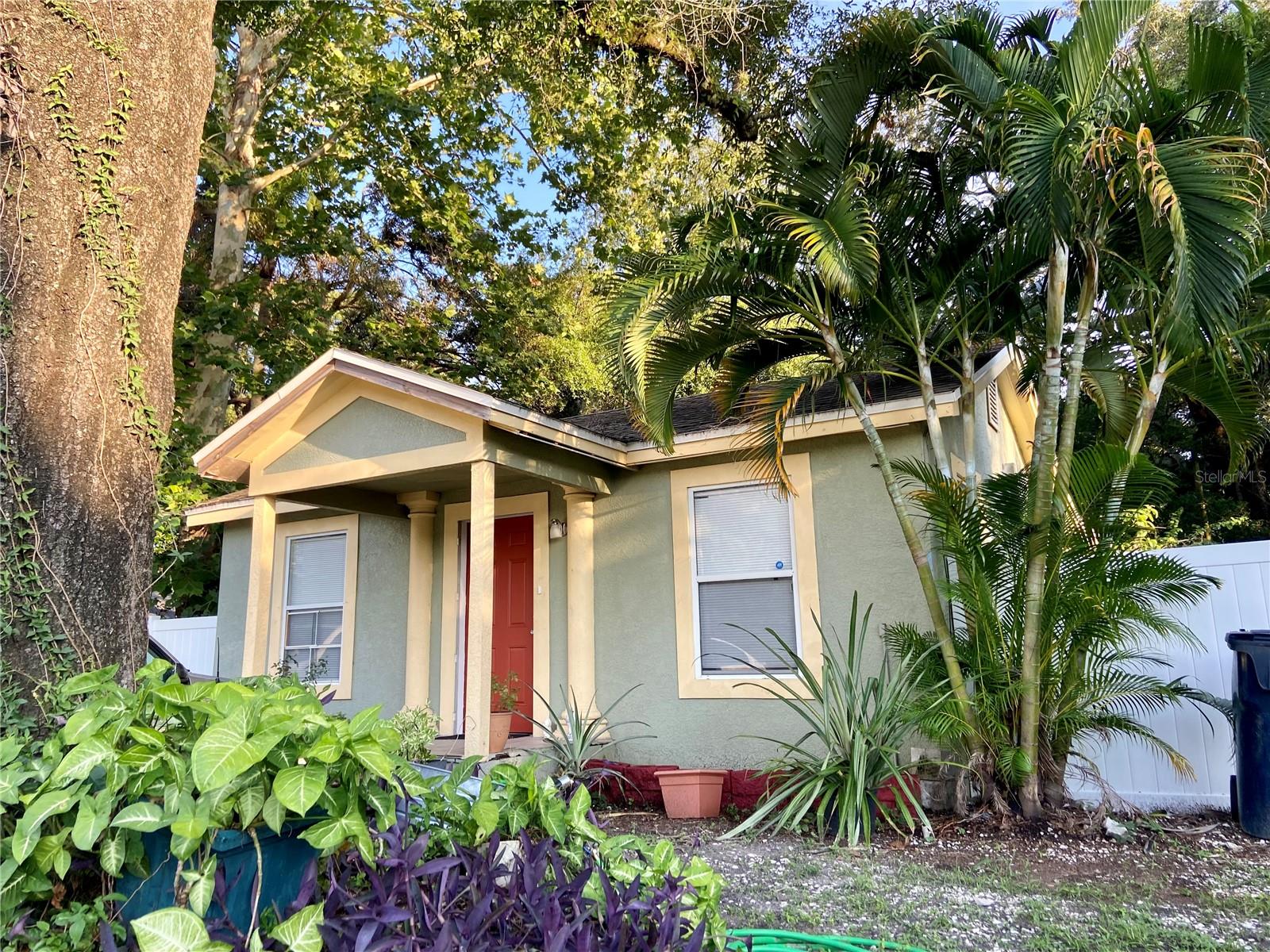 This 3 bedroom, 2 bath home boasts a detached, air-conditioned mother-in-law suite in the oversized, fenced backyard, making this a great 4 bedroom and 3 bathroom property in the highly desired, up-and-coming Seminole Heights!  This area is quickly becoming one of the most sought-after neighborhoods in Tampa, filled with old bungalows, eclectic shops, gourmet dining, a unique bar scene and a modern bohemian appeal reflected in the artists, musicians, hipsters, and young families who live here. And now is your chance to add to the zest that is Seminole Heights!  In the main house, gather your friends and family in the living room, then bring the fun outdoors in your spacious backyard.  There is plenty of room for grilling, playing a game of catch, and if you want to add a pool, there is more-than-enough space.  You even have a dog run for your pets!  Your galley kitchen has room for cooking, eating, and hanging out with guests.  The three bedrooms provide ample room and privacy.  Did I mention that there is no HOA!!  The water heater and electric were replaced in 2023.  The AC was replaced in 2021.  You'll be a short distance from great restaurants, food trucks, and trendy nightlife here in Seminole Heights.  You're also a short drive to the Hard Rock Hotel and Casino, the Amphitheatre, and Tropicana Field, not to mention the beaches along the Gulf and the Bay!  Come see why Seminole Heights is a sprawling and vibrant community, and one you can soon call "home"!