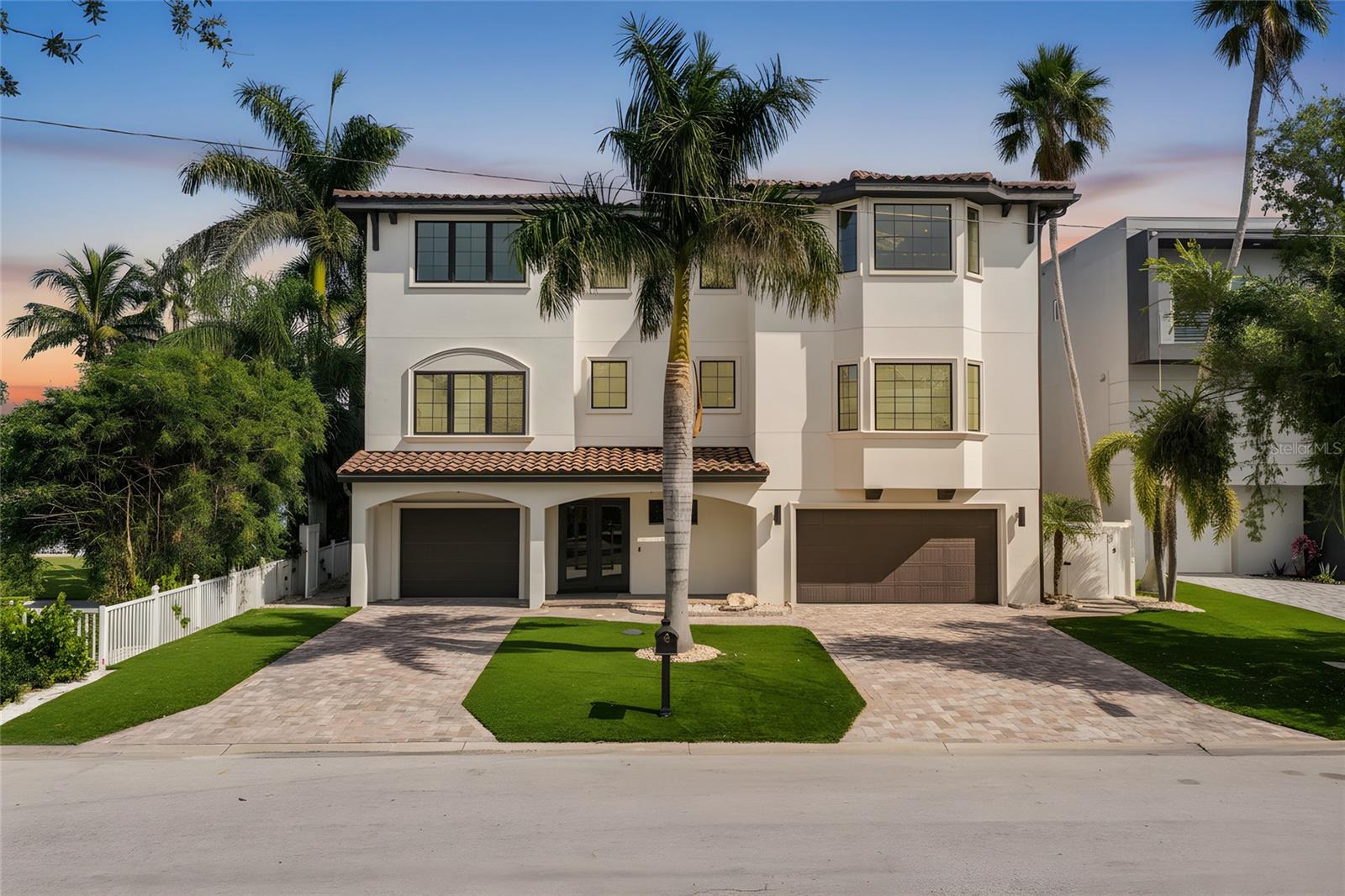 If you are you looking for open water, you've found it on Boca Ciega Bay.  Boasting a 30,000 lb high speed boat lift with composite decking, and a step down for easy boat access.  When you're not out boating, enjoy fishing off your dock as dolphin and manatee swim-by.  Ground level includes heated pool and attached spa and water features.  Enjoy sitting around a large stone-built gas fire-pit, surrounded by artificial turf and mature palm trees. Let's begin on the ground level; this property comes with a brand-new outdoor kitchen, equipped with new ice maker, refrigerator, granite countertops and seating for up to 12.  All cabinets are outdoor rated. There's more; an additional kitchen area with a gas grill-top BBQ.  Sonos speakers carry the music all the way to the dock.  

A 3-car garage and tandem parking for 5 cars or use it as a 3-car garage and an exercise area with air-conditioning, mirrors and TV all included! Plenty of custom built-in storage and workbench for all your chores.

Time to enter through the front door......designer custom steel doors leading to the foyer, additional storage and elevator service. On the 2nd level, the view begins!  There's 4-sliders with two 8' high glass panels on both sides, affording a panoramic open-water view of Boca Ciega Bay!  To the left you will find a custom wall with a 98" electric fireplace coupled with a 98" TV and a Sonos sound system; this great room is outrageous.  In the center of the room, there's ample space for a dining table that seats 8, with a custom contemporary chandelier.  Further to the right, is a large kitchen boasting two 10' islands!






There's a Butler's Pantry and walk-in pantry; perfect for your coffee station.  Now walk out to the 12' x 36' tiled patio with complete outdoor kitchen including refrigerator, sink and BBQ and don't forget the magnificent view!

Stroll back inside and there's a custom-built bar with seating for 12.  Complementing this bar is the 3rd sink, a dishwasher and a combination wine cooler, fridge and freezer.  A full-size TV, Sonos soundbar and rear speakers complete this unique space.  

Also on this floor is a flex room measuring 16' x 16' with a bay window.   This room can be used as a formal dining room or an office.  A half bath is available in the adjoining hall for convenience.  Bedroom #1 is 15' x 16' ensuite with a walk-in closet

Onto the elevator to the 3rd level.  As the door opens you are greeted with a 17' x 22' additional flex room with Sonos TV and Soundbar.  This room has 3 sliders opening to an even grander view of Boca Ciega Bay, with a 12' x 24' tiled patio.  You will also find two additional guest rooms, one of which can be a second Primary Bedroom with an ensuite, 15' x 24', with a grand water view.  The second guest room on this level is 14' x 14'.  Now, enter through double doors to your primary suite, 19' x 27' allowing for second living area with a wet bar, TV with Sonos Soundbar, refrigerator and sink and don't forget the view!  A perfect space for your morning coffee.  Two large walk-in closets, ensuite boasting a large walk-in shower with multiple showerheads.

Experience this exceptional waterfron home with its breathtaking views, elegant finishes, and unparalleled outdoor living spaces! Its a must see home!