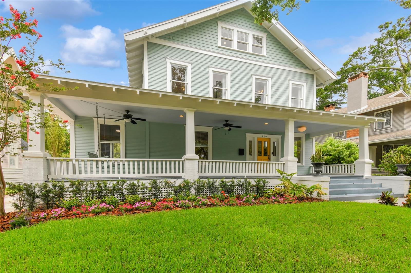 Beautifully updated historic Hyde Park home with a charming front porch located outside of the flood zone at over 22 feet above sea level. Recent updates include a new roof, AC units, updated plumbing, and wiring. The gorgeous new open eat-in kitchen/family room features a fireplace, walk-in pantry, leathered marble island, custom cabinetry to the ceiling, and a library ladder for easy access to upper cabinets. Additional amenities include a mudroom, downstairs powder bath, sunroom with abundant windows, and a formal living room with a fireplace.
Upstairs, the primary suite boasts a new bath and walk-in closet. Three additional bedrooms, a hall bath, and an en-suite bath complete the second floor. The third floor offers a bonus room with gleaming oak hardwood floors.
The beautifully landscaped and fenced backyard features turf, an automated gate for garage/driveway access, and a generously sized back porch. The 2-car garage includes a pull-through to the alley and an upstairs bonus room. Don’t miss the opportunity to own this exquisite blend of historic charm and modern luxury.