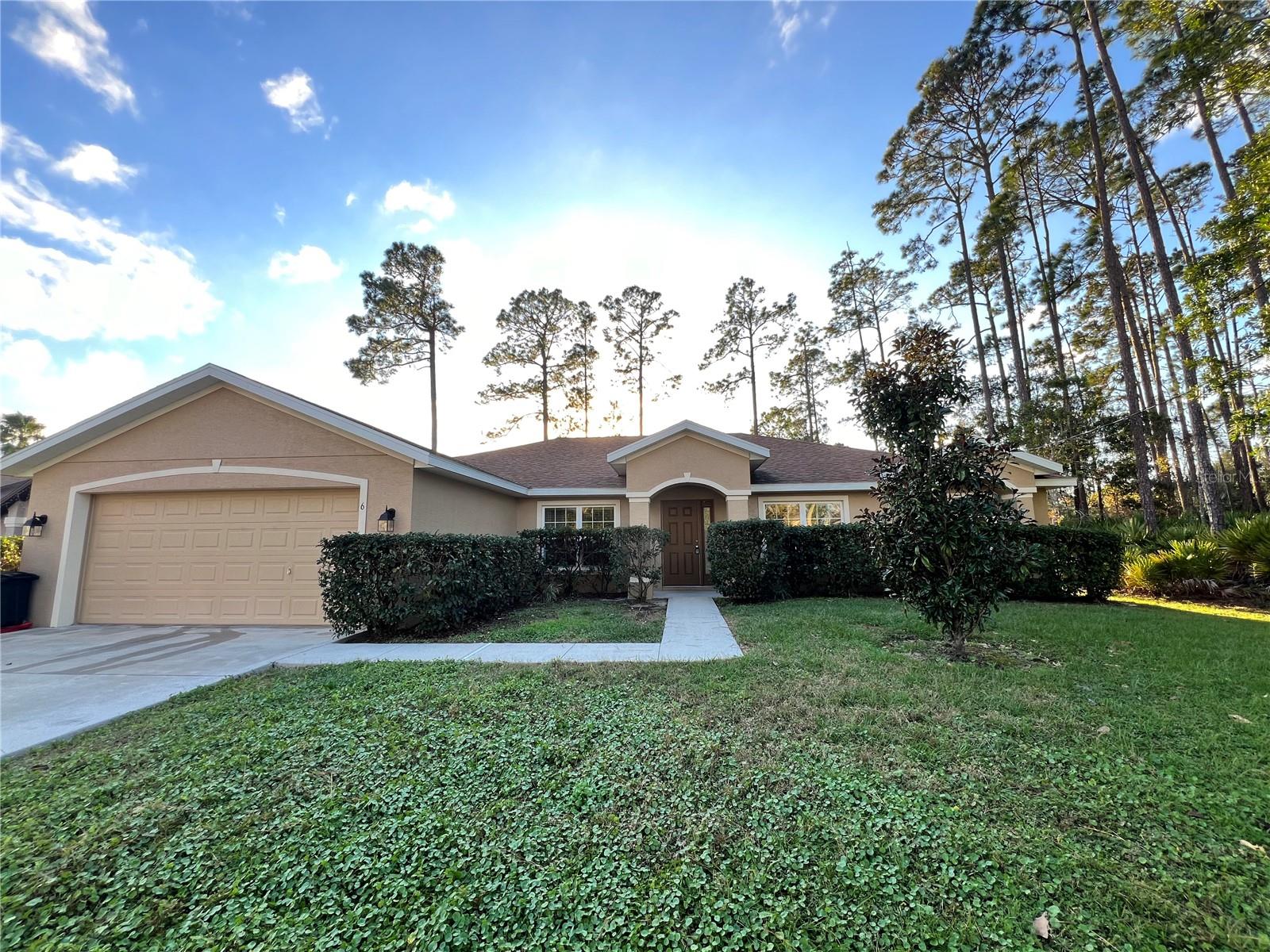 Well-tended 2017 year build over 2200 sq. ft. 4 bed/2 bath/2car garage house. Engineered for comfortable and efficient living, you will appreciate splendid and smart open floor plans. The oversized windows and sliding glass doors let in tons of natural light. High ceilings throughout make all areas airy, bright, and expansive. The house is finished with exquisite taste, luxurious options, and upgrades: spectacular 42" kitchen cabinets w/ granite counters, huge kitchen island, SS appliances including french door refrigerator, tile flooring in all common areas,  master bathroom offers a walk-in shower, modern all tiled bathrooms and a bunch of vanities. The storage solution includes huge his/her walk-in closets attached to the master suite, a separate linen closet, and an oversized laundry room. THE HOME IS LOCATED IN THE DESIRABLE INDIAN TRAILS SUBDIVISION RIGHT IN THE HEART OF PALM COAST WITH EASY ACCESS TO SCHOOLS, SHOPPING, BEACHES, PARKS, A NEW HOSPITAL, RT95 EXIT 298.