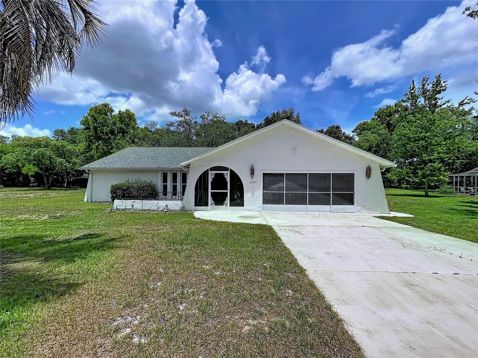 Lovingly maintained by the same owner for many years, this home is ready for its next chapter. Offering plenty of room inside, 3 bedrooms 2 full bathrooms, a laundry room, and patio overlooking the screened in private pool. Situated on a half-acre lot, this property also includes a spacious shed, with electricity.  
Major updates have already been completed, including a new ROOF (2024) all WINDOWS replaced (2020) along with a new replaced A/C (2022) providing peace of mind while leaving the cosmetic updates to you, this is the one for your personal vision to come to life. If you've been waiting for a home with solid bones, room to build equity, and the chance to truly make it your own, this is the one you won't want to miss.
Located in a desirable Spring Hill neighborhood with convenient access to shopping, healthcare, and Florida's Nature  Coast attractions.