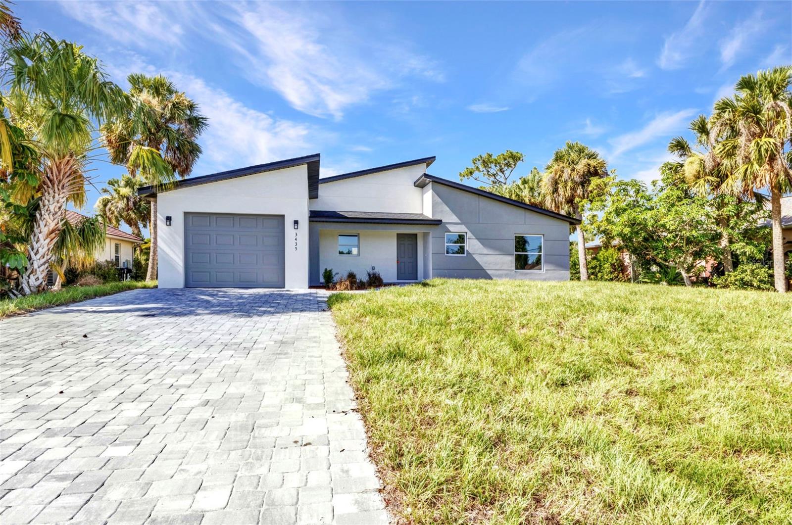 This brand new 4-bedroom, 2-bathroom contemporary modern home is ready for you to move in and enjoy. Built with quality and comfort in mind, it features tile flooring throughout, granite countertops, stainless steel appliances, and hurricane impact windows for peace of mind.

The open kitchen and living area offer a clean, modern feel with plenty of natural light. The primary suite includes a tiled walk-in shower, soaking tub, and a large walk-in closet. The second bathroom is also fully tiled and easy to maintain.

All ceiling fans and lighting fixtures are installed, so there's nothing left to do but move in. Outside, you'll find a pavered driveway and simple, modern curb appeal.

 Located just minutes from shopping, restaurants, and with quick access to the highway. You're also a short drive from beautiful beaches and popular amusement parks