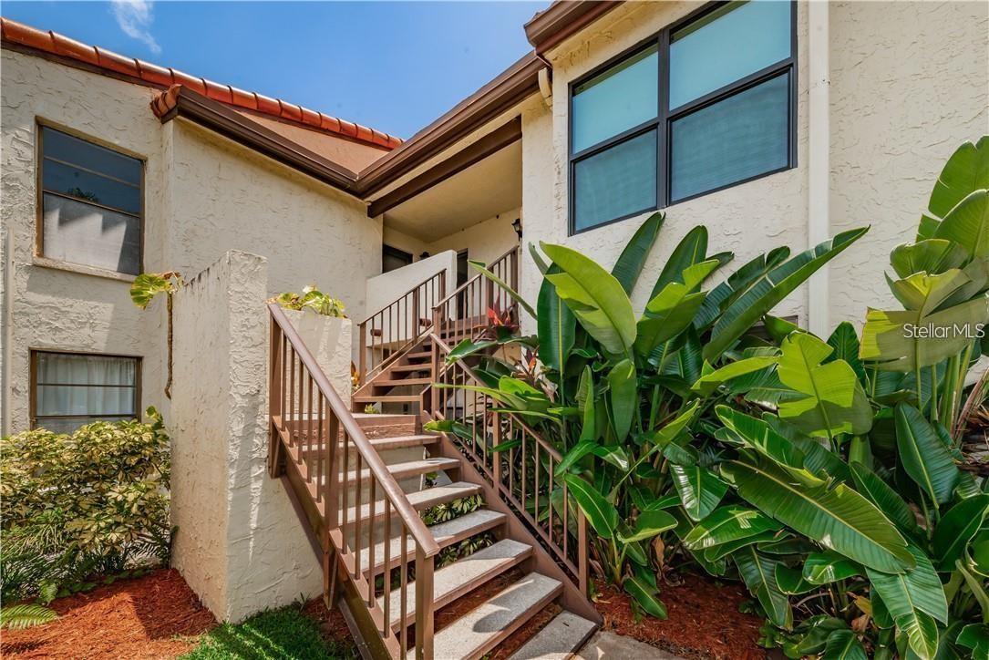 Experience Florida living at its absolute finest! Fall in love with this stunning, fully renovated 1-bedroom, 1-bathroom condo offering a luxurious, turnkey lifestyle. Offered completely furnished and short-term rental ready, this unit features a spectacular open-concept layout with gorgeous new tile flooring and fresh modern finishes. The updated kitchen is equipped with granite counters and stainless steel appliances, and it seamlessly flows into the spacious living and dining areas. Enjoy peaceful morning coffee or evening breezes from dual private balconies—accessible from both the main living area and the oversized bedroom—boasting views of the community pool and the canal leading to Lake Tarpon. Residents enjoy top-tier community amenities, including a sparkling pool, heated spa/hot tub, a clubhouse, and boat docks. Superbly located close to world-class beaches, championship golf courses, and vibrant dining. Whether looking for a lucrative rental asset or a private vacation oasis, this pristine condo delivers it all! AIRBNB READY, FULLY TURNKEY, AND COMPLETELY REMODELED! Welcome to paradise in Palm Harbour! MOVE  IN READY!! BRING YOUR TOOTHBRUSH!!