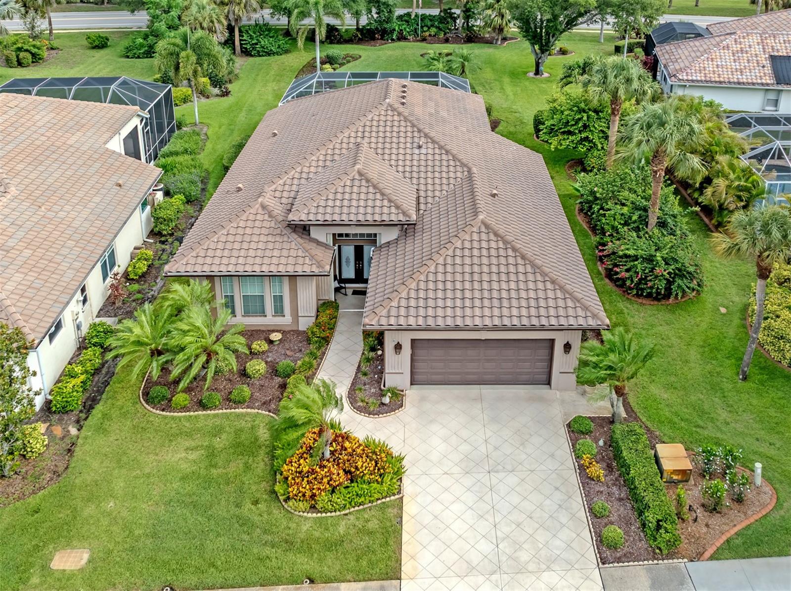 Welcome to this beautifully maintained and thoughtfully updated residence offering the perfect blend of elegance, comfort, and Florida living. From the grand double-door entry and soaring volume ceilings to the refined crown molding throughout, every detail has been designed to create a warm and inviting atmosphere.
The spacious floor plan features three bedrooms, two bathrooms, and a two-car garage, with multiple areas for gathering and entertaining. The updated kitchen is truly the heart of the home, showcasing granite countertops, stainless steel appliances, a center cooktop island, breakfast bar, and abundant workspace. Adjacent to the kitchen are a separate dining room and sunny breakfast nook, providing a variety of options for both casual and formal dining.
The private owner's retreat is accessed through elegant double doors and offers a luxurious en-suite bath complete with granite counters, dual sinks, a makeup vanity, walk-in shower, and an exceptionally large walk-in closet.
Step outside and discover your own tropical oasis. The heated pool and spa are surrounded by an attractive decorative concrete deck, creating the perfect setting for relaxation or entertaining family and friends. Outdoor dining areas invite you to enjoy Florida's beautiful weather year-round.
Situated on an oversized homesite of more than 13,000 square feet, the expansive backyard provides exceptional privacy and room to enjoy. Constructed of sturdy block construction, this home offers peace of mind with a new roof installed in 2023 and hurricane shutters protecting all windows. Located in a desirable flood zone "X".
Located in coveted Lakes of Jacaranda, with HOA fees of $975./year and NO CDD fees.  Enjoy walking paths around our many ponds, tennis courts, community pool and a clubhouse available for your private engagements. This deed restricted community helps maintain your property values.
Combining timeless architectural details, quality updates, and outstanding indoor-outdoor living spaces, this exceptional property delivers the Florida lifestyle you've been searching for.