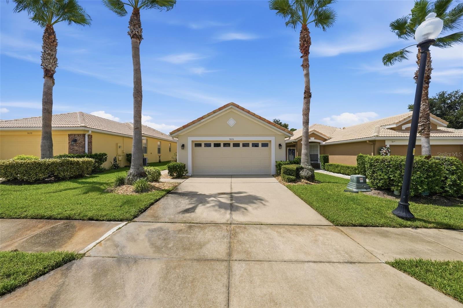 Virtually Staged. Welcome to your new home in the highly desirable Country Club of Mount Dora! Partially furnished for an easy move-in, this meticulously maintained home at 9076 St. Andrews Way offers the perfect blend of comfort, convenience, and an active Florida lifestyle. Step inside to discover a bright, open floor plan designed for both everyday living and entertaining. The spacious kitchen overlooks the living area with a convenient breakfast bar, making it easy to stay connected while preparing meals. A generously sized laundry room with a utility sink adds extra functionality, while the split-bedroom layout provides privacy for both owners and guests. Unwind on the inviting patio, where peaceful open views create the perfect setting to relax at the end of the day. Until you have your own golf cart, enjoy the bicycles that are included with the home and explore this beautiful golf course community. Your HOA membership includes access to the St Andrews community pool, clubhouse, and fitness center. Additional community amenities include golf, pickleball, tennis, a playground, and Beacon 19 Restaurant just moments away. Ideally located near shopping, dining, medical facilities, and the charming historic downtown Mount Dora, you'll enjoy easy access to boutique shopping, local restaurants, art galleries, community events, and the area's popular seasonal festivals. This is more than a home—it's a lifestyle. Schedule your private showing today and discover everything this exceptional property and community have to offer!You will not be disappointed!