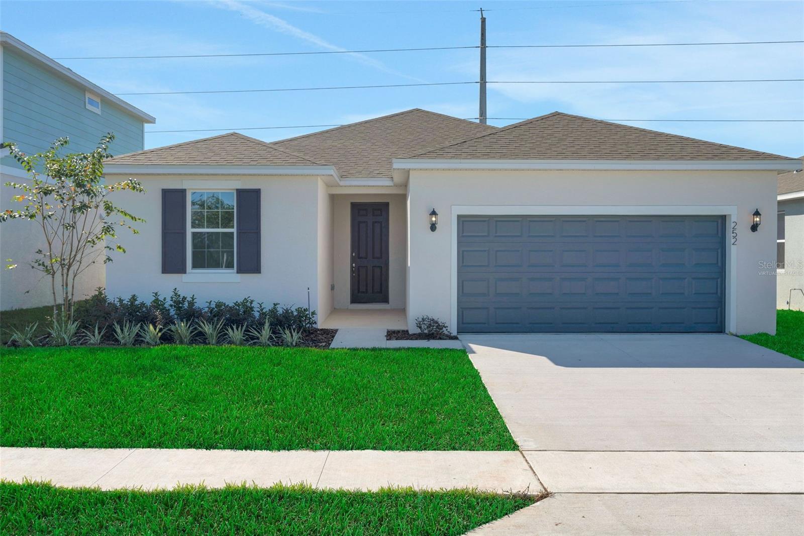 Virtually Staged. Under Construction. Hillcrest floorplan, located in the highly sought-after community of Willowbrook near a beautiful golf course in Winter Haven, FL. This spacious 4-bedroom, 2-bath home offers 1,758 square feet of living space and provides excellent curb appeal in its elevation. Inside, you'll find gorgeous White cabinets complemented by sleek quartz countertops in the kitchen, creating a modern, bright atmosphere. Tile flooring runs throughout the wet and common areas, offering durability and easy maintenance. The open layout is perfect for family gatherings and entertaining guests.