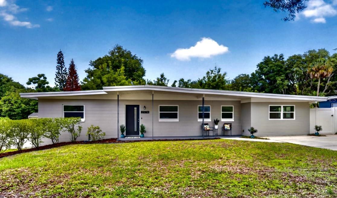 Virtually Staged. WINTER PARK 32789 in the highly sought-after Dommerich Elementary, Maitland Middle, and Winter Park High school district. This is the kind of home buyers hope to find but rarely do — a beautifully updated mid-century modern with the character of the 1960s and the peace of mind that comes from extensive major improvements already being completed. From the moment you arrive, the oversized 76x133 lot, inviting front porch, and clean curb appeal set the tone. Inside, original terrazzo floors, vaulted ceilings, and a bright open great room create warmth, charm, and livability. French doors open to a screened porch overlooking the spacious backyard. The split-bedroom floor plan features two renovated bathrooms, while the redesigned kitchen offers brand-new appliances, cabinetry, and quartz countertops. A spacious 19x12 family room with tile flooring connects to a large inside laundry room with abundant storage and flexible workspace options. Beyond the visible updates, this home stands apart because so many of the expensive and often-overlooked improvements have already been done, including roof, plumbing re-pipe, septic/drainfield improvements, electrical updates and full-house rewire, hurricane-impact windows, impact front and rear doors, new mini-split HVAC systems, cast iron drain replacement, interior and exterior paint, and more. A rare opportunity to own a thoughtfully improved home in one of Winter Park’s most desirable locations — with no HOA.  WELCOME HOME!