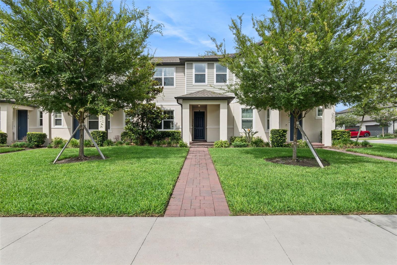 Welcome to Legacy Place—where style, function, and low-maintenance living come together in this beautifully maintained townhome. Built in 2022 and offering 3 bedrooms, 2.5 bathrooms, 1,806 square feet, and an attached 2-car garage, this move-in ready home delivers the benefits of newer construction without the wait.  Step inside to a bright open-concept floor plan where abundant natural light streams through oversized windows and sliding glass doors, creating a warm and inviting atmosphere throughout. Designed for both comfortable everyday living and effortless entertaining, the spacious living, dining, and kitchen areas flow seamlessly together, enhancing the home's sense of openness and connection.  The kitchen is a true focal point of the home, appointed with 42-inch solid wood cabinetry, stainless steel appliances, granite countertops, a large center island with breakfast bar seating, a dedicated coffee bar, and an oversized walk-in pantry. Both elegant and highly functional, the space is perfectly suited for everyday living, effortless entertaining, and gathering with those who matter most.  Beautiful wood-plank tile flooring extends throughout the first floor, creating a clean, cohesive designer feel. Sliding glass doors seamlessly blend indoor and outdoor living, leading to a private patio—an inviting extension of the home that's perfect for grilling, morning coffee, or relaxing around a fire pit on cooler Florida evenings.  The first floor features all main living areas along with a conveniently located guest bath, while the upstairs layout offers privacy and separation from the home's entertaining spaces. The spacious primary suite serves as a peaceful retreat, featuring a generous walk-in closet, dual-sink vanity, walk-in shower, and private water closet. Two additional bedrooms, a full guest bath, and the conveniently located upstairs laundry area complete the second floor.  Storage is abundant throughout the home, offering practical solutions that make everyday living easy and organized.  Additional highlights include a ROOF, A/C, and WATER HEATER all NEW in 2022 providing valuable peace of mind and long-term value.  Ideally located in Legacy Place, residents enjoy quick access to SR-417 and I-4, providing convenient connections to Winter Park, Oviedo, downtown Orlando, shopping, dining, and major employment centers. Community amenities include a dog park, playground, grilling area, putting green, Yoga lawn, community exercise path, and a permanent cornhole set-up, creating opportunities to enjoy the Florida lifestyle close to home.  Beautifully maintained, thoughtfully designed, and perfectly located—this exceptional townhome offers the ideal combination of comfort, convenience, and modern living. Don't miss this opportunity!  Schedule your private showing today.