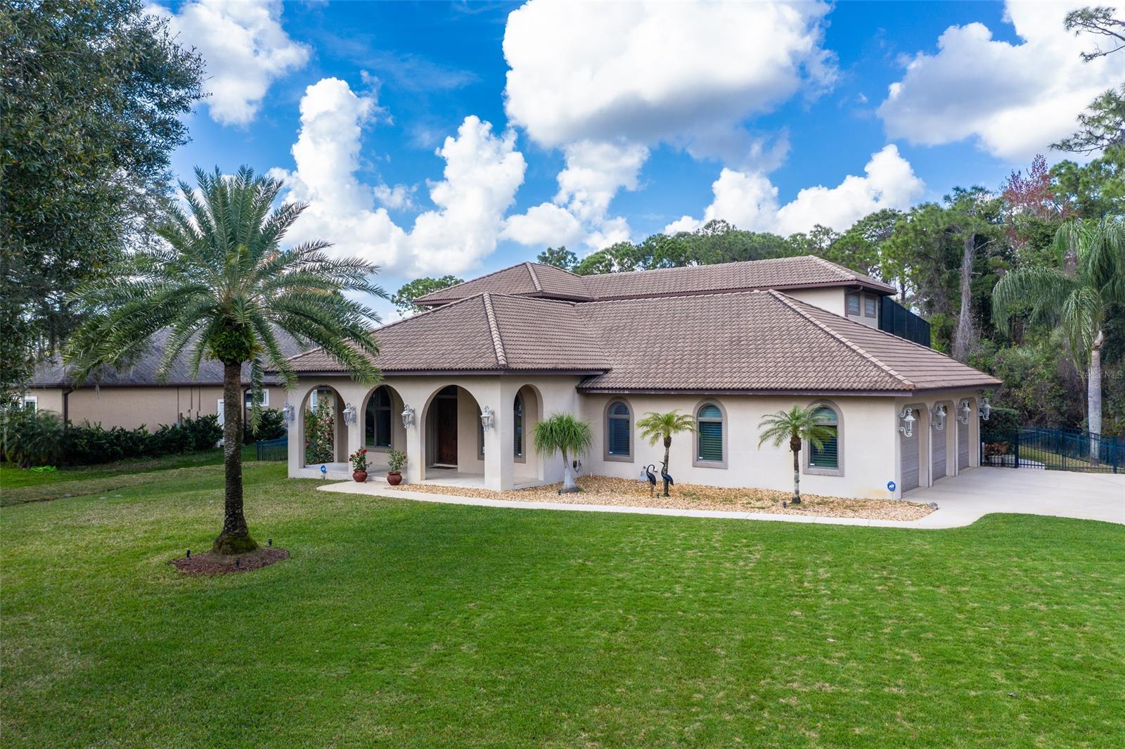 Sugar Mill Country Club impeccably built Butch Frye custom masterpiece with every attention to detail. Very private 3/4 acre home wide open floor plan very conducive to entertaining. Incredible Saltwater Pool and area seem more like a resort and with a Hot Tub all heated with Natural Gas. Fabulous gourmet kitchen with room to roam. In fact every room in this home is oversized. And all open to the 2 story screen pool enclosure which was re-screened 5 years ago. Master bedroom up and down. Upstairs is the owner retreat with huge MBR opening with balcony over pool and matching closets that could be extra BRs! Huge master bath. Exercise room/office downstairs could be 4th BR. Full Bathroom off the kitchen with Pool Access allows you to shower after swimming. Hall wine bar off formal DR. Large laundry room houses W/D, 2nd frig and sink. Huge 3 car garage with room for projects. Everything here is top notch and oversized. Sugar Mill is the finest of locations with mature landscaping , chirping Birds and Nature. A Championship 27 hole golf course for the Golfers amongst you. ;Water: City