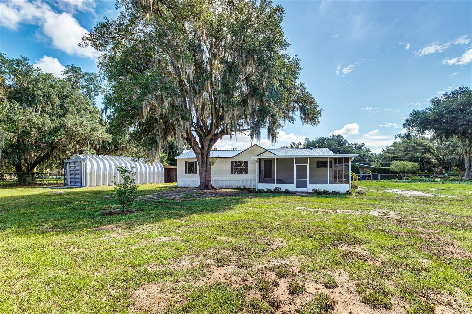 Welcome to this beautifully renovated 3-bedroom, 2-bathroom home in Lakeland, offering the perfect blend of modern updates, functional living space, and room to enjoy the outdoors. Situated on a spacious 0.55-acre lot, this move-in ready property provides comfort, versatility, and the freedom of no HOA restrictions.
Recent updates throughout the home offer peace of mind, including a new A/C system, updated plumbing and electrical fixtures, and a brand-new drain field. Inside, you'll find inviting living spaces featuring durable luxury vinyl plank flooring throughout the main living areas, while all bedrooms have been updated with brand-new carpet and ceiling fans for added comfort. The fully renovated kitchen serves as the heart of the home, showcasing brand-new cabinetry, updated countertops, and a complete appliance package including a refrigerator, range, microwave, and dishwasher. Both bathrooms have been fully remodeled with updated finishes, creating a fresh and modern feel throughout the home.
The thoughtfully designed floor plan offers comfortable bedrooms, spacious common areas, and plenty of natural light throughout. Whether you're entertaining guests or simply enjoying a quiet evening at home, the layout provides a balance of comfort and practicality.
Step outside and enjoy the Florida lifestyle from the screened front porch overlooking the property. The fully fenced yard offers plenty of space for pets, outdoor activities, gardening, or future additions. A standout feature of the property is the impressive 32x20 detached metal building with covered storage, providing endless possibilities for a workshop, storage, hobbies, equipment, or recreational vehicles.
USDA FINANCING AVAILABLE FOR ELIGIBLE BUYERS, WITH NO MONEY DOWN. CALL TODAY FOR MORE DETAILS.