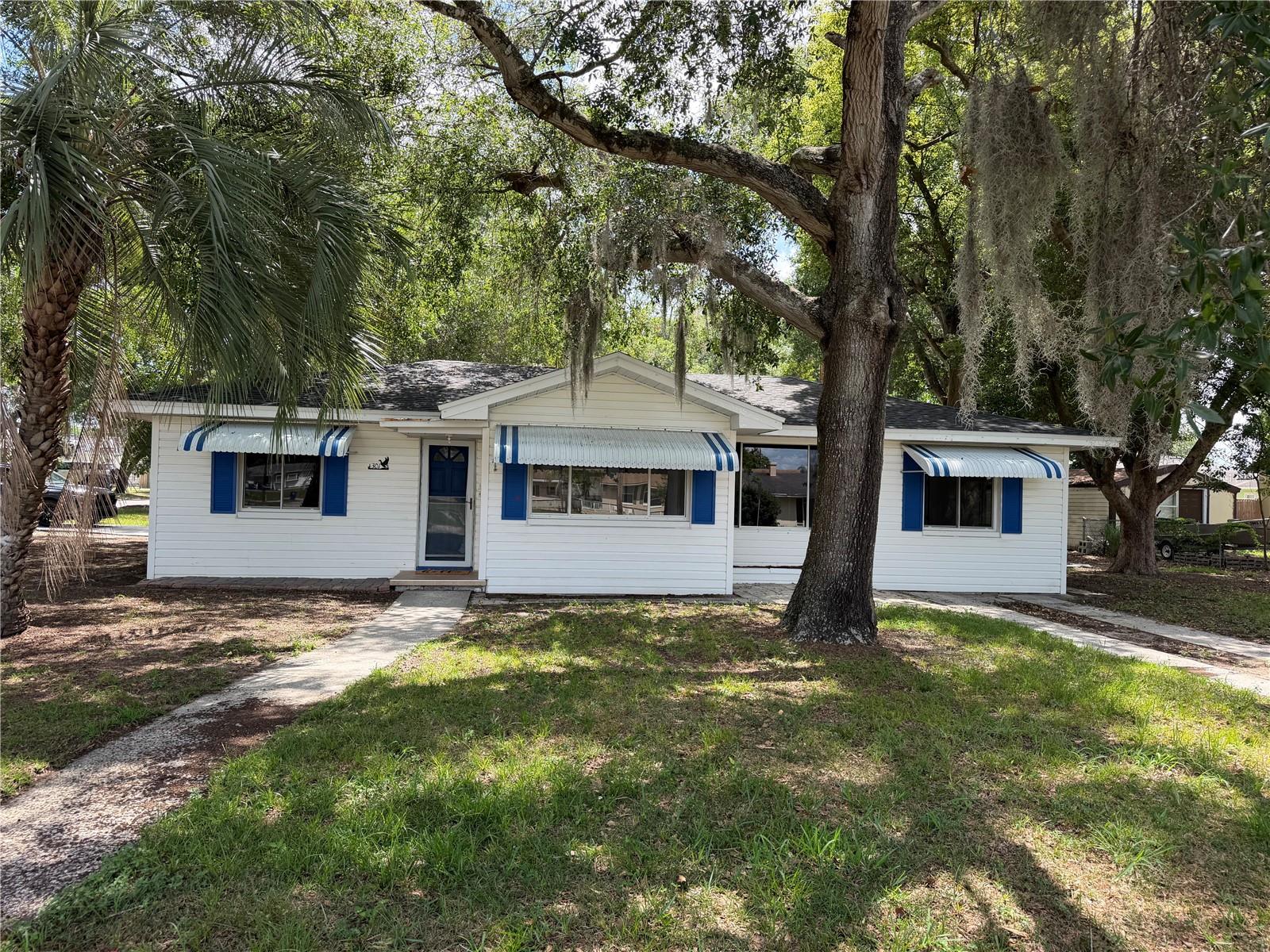 Completely renovated 2-bedroom home in desirable Minneola, FL — ideally located less than 10 minutes from Downtown Clermont, the waterfront, scenic walking and biking trails, restaurants, breweries, shopping, and live entertainment. This beautifully updated home features a bright open layout with abundant natural light, modern finishes, and thoughtful upgrades throughout. The spacious living areas are complemented by oversized windows, recessed lighting, elegant wood-look tile flooring, and brand-new modern ceiling fans that create a clean, contemporary feel. The fully remodeled kitchen and living spaces flow seamlessly, making the home feel open, comfortable, and inviting. Both bedrooms offer expansive closet space with custom built-in shelving and storage solutions rarely found in other homes. The stunning bathroom has been fully redesigned with luxury finishes including a large walk-in glass shower, marble-style tile from floor to ceiling, updated vanity, and modern fixtures that give the space a spa-like atmosphere. Additional upgrades include brand-new insulation for excellent energy efficiency, helping keep electric bills very modest year-round. With the roof, AC and water heater all replaced in the last 5 years- you truly are walking into what feels like a brand new home! Every detail of this renovation was carefully completed to provide comfortable, low-maintenance living with modern style and functionality. Call for your private showing today!