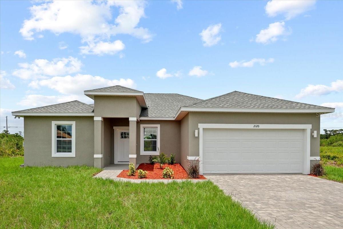 Enjoy comfort, style, and the Florida lifestyle in this beautifully upgraded home located in a highly desirable community filled with exceptional amenities. Thoughtfully designed with a modern and functional open floor plan, this residence offers an inviting atmosphere ideal for both everyday living and entertaining.

Seller is offering up to $3,000 toward buyer’s closing costs for buyers financing through the preferred lender — helping reduce upfront expenses at closing. Contact listing agent for details.

Inside, the home features bright and open living spaces enhanced with premium upgrades beyond the builder’s standard finishes. Upgraded wood flooring, designer lighting throughout the main living areas, and stylish light fixtures create a warm and elegant ambiance.

The kitchen serves as the centerpiece of the home, featuring a stunning quartz waterfall island overlooking the family room — creating a seamless environment for gathering, entertaining, and staying connected with family and guests. Upgraded cabinetry with soft-close drawers and doors adds a touch of luxury and durability, while stainless steel hardware, faucets, and door handles provide a sleek, modern finish throughout the home.

Additional premium features include ceiling fans in the living room and primary suite, upgraded high-profile baseboards, enhanced interior finishes, and preparation for smart home features designed to complement today’s lifestyle.

Beyond the home itself, residents enjoy access to outstanding community amenities, including an official 18-hole golf course, a navigable lake perfect for boating and water recreation, and a fishing pier for those who enjoy relaxing outdoor experiences and Florida’s natural beauty.

Move-in ready and thoughtfully upgraded, this exceptional property offers the perfect combination of elegance, comfort, functionality, and resort-style living.