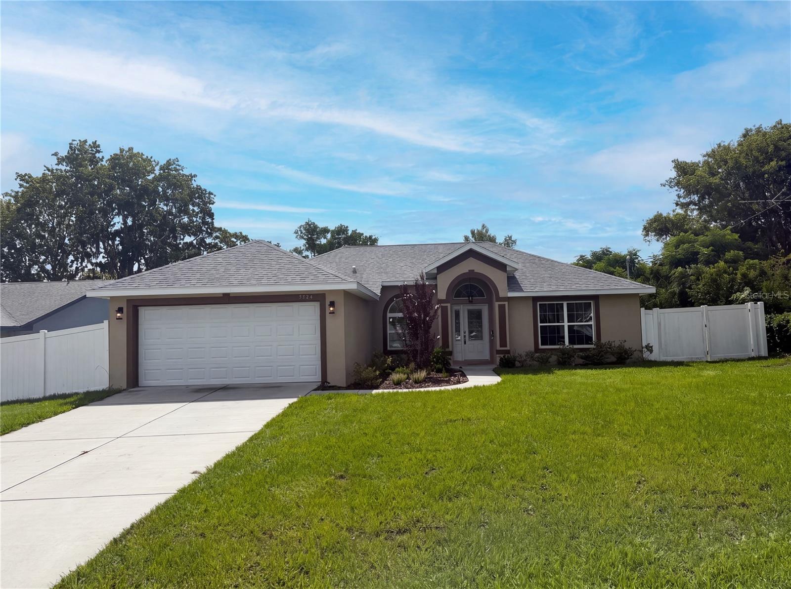 Welcome to this beautifully maintained 2023-built home offering the perfect blend of modern design, everyday functionality, and the freedom of **NO HOA** and **NO CDD** fees. Thoughtfully refreshed and move-in ready, this home presents an exceptional opportunity for buyers seeking contemporary finishes without the wait of new construction.

The open-concept layout features waterproof luxury vinyl plank flooring throughout the main living areas, kitchen, and bathrooms, creating a seamless and low-maintenance living space. The kitchen is equipped with stainless steel LG appliances, all-wood cabinetry with soft-close drawers, and generous counter space, making it equally suited for everyday living and entertaining. Ceiling fans throughout the home provide added comfort, while the spacious bedrooms offer plush carpeting for a warm and inviting retreat.

Additional highlights include an interior laundry room with a utility sink, a fully sodded yard with attractive front landscaping, and a 12' x 12' rear patio that's ready for outdoor dining, grilling, or relaxing.

Conveniently located near shopping, restaurants, medical facilities, parks, and the natural beauty of Weeki Wachee Springs, with quick access to the Suncoast Parkway for an easy commute to Tampa and surrounding areas. Offering the appeal of newer construction in an established setting, this is a home you'll want to see for yourself.