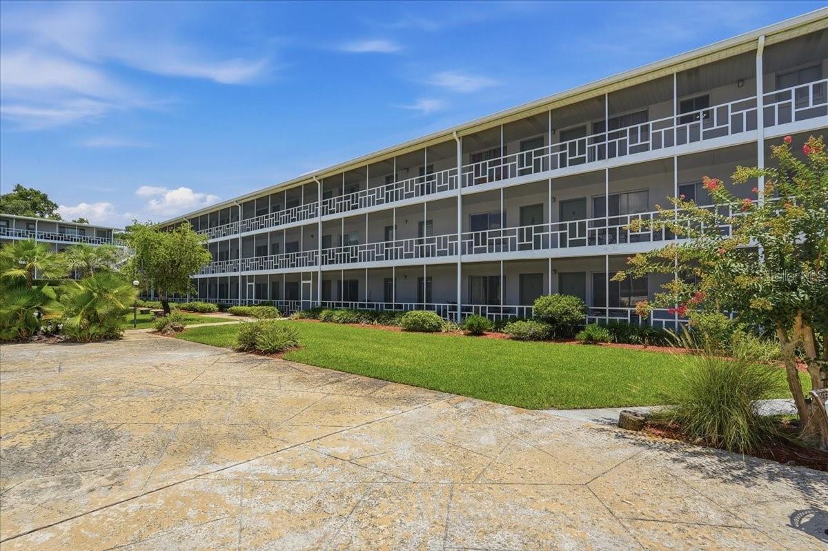 Peaceful oasis in a premier 55+ community! This lovely 2 bedroom, 1 bath second-floor condo in Winter Haven Harbour Apartments offers a perfect blend of comfort, functionality, and an active, low-maintenance lifestyle.  Inside, you will find a spacious living room that flows effortlessly into a dedicated dining room, and a galley-style kitchen that maximizes counter space and storage, making meal preparation a breeze. Step onto your private balcony, where you can enjoy your morning coffee, read a book, or soak in the serene views. This wonderful active community offers fantastic resort-style perks, including a sparkling heated community pool, an active community center, and shuffleboard courts for fun with friends and neighbors. This home provides the ideal setting for your next chapter. Don't miss out, schedule your appointment today.