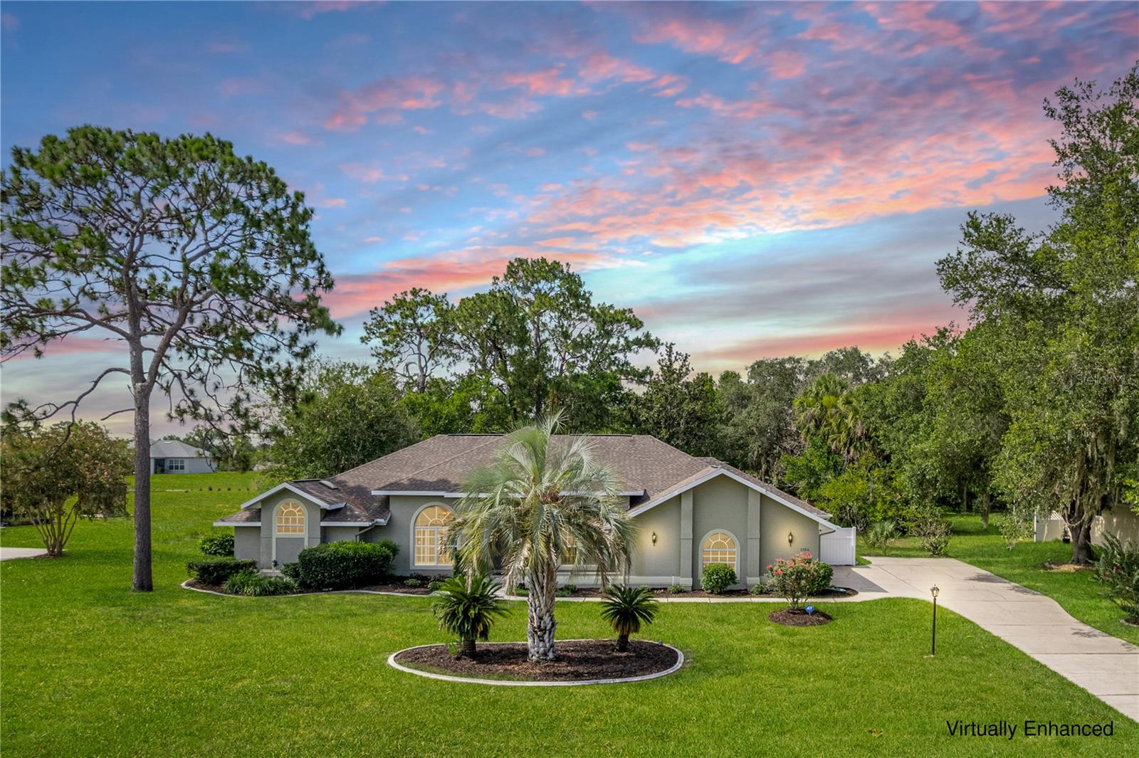 Virtually Staged. Welcome to your private Florida retreat! Nestled on a beautifully landscaped 1-acre homesite in the highly sought-after Clearview Estates community of Citrus Hills, this beautifully updated 4-bedroom, 3-bath pool home offers the perfect blend of privacy, space, and modern comfort. Enjoy the freedom of low annual HOA dues of just 281 dollars with no required social or golf memberships, allowing you to enjoy the community on your own terms while still qualifying for the exclusive Citrus Hills VIP Golfer Program.

This move-in-ready residence welcomes you through grand double doors into bright, light-filled living spaces featuring elegant porcelain and bamboo flooring, separate living, family and dining rooms, and an open, functional floor plan designed for both everyday living and effortless entertaining.

The beautifully remodeled kitchen serves as the heart of the home, showcasing rich granite countertops, a large center island, breakfast nook, abundant cabinetry, and generous workspace that makes preparing meals and gathering with family and friends both enjoyable and convenient.

Escape to the spacious primary suite where you'll find dual walk-in closets and a completely renovated spa-inspired primary bath completed in June 2026, featuring a luxurious freestanding soaking tub, split double vanity, and an oversized walk-in shower designed to create a true owner's retreat. Three additional bedrooms and two full guest baths provide flexibility for family, overnight guests, or a dedicated home office.

Step outside and discover your own backyard oasis. The screened inground pool features a newly resurfaced pool finish and cool deck completed in June 2026, creating the perfect setting for year-round relaxation, weekend gatherings, or simply enjoying the peaceful surroundings of your private one-acre property. A detached storage building with electricity and a one-car roll-up door offers exceptional versatility as a workshop, hobby space, fitness room, she shed, man cave, or additional storage.

Additional features include an oversized 24' x 24' two-car garage, an interior laundry room with built-in cabinetry and utility sink, a new water heater installed in 2023, a 10-zone irrigation system, city water, septic, and a transferable Centricon termite protection policy for added peace of mind.

Ideally located just minutes from shopping, restaurants, medical facilities, and championship golf, this exceptional property also places you near horseback riding trails, hiking, boating, kayaking, fishing, crystal-clear natural springs, parks, and Florida's scenic Nature Coast. Orlando's world-famous theme parks and the Gulf Coast's award-winning beaches are all within an easy one-tank drive, making this an ideal location for those seeking both peaceful country living and convenient access to some of the state's most desirable destinations.

Rarely does a home offer this combination of updated living spaces, a private 1-acre homesite, resort-style outdoor living, and an unbeatable location--all with no mandatory memberships. Schedule your private showing today and experience everything this exceptional property has to offer.