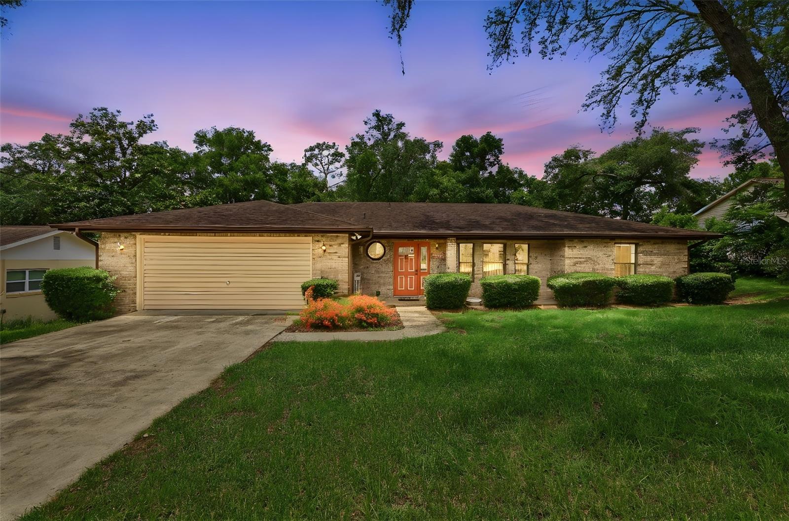 One or more photo(s) has been virtually staged. Welcome to Country Club Estates — one of DeLand’s most established and highly sought-after communities with no HOA restrictions and a prime location close to shopping, dining, and downtown charm. This custom-built brick home has been carefully maintained and lovingly kept in the same family for its entire history, reflecting true pride of ownership throughout.
This 3 bedroom 2 bath home features a spacious formal living room and separate dining room designed for both everyday comfort and entertaining. The updated kitchen features bright cabinetry, ample counter space, and a welcoming feel that opens beautifully to the main living areas. Updated vinyl flooring throughout the main living spaces adds a fresh, modern touch. Enjoy year-round relaxation in the Florida room overlooking the oversized fenced backyard, and wood deck complete with outdoor shower — perfect for pets, gatherings, or gardening. With its solid exterior, mature neighborhood setting, and generous lot size, this home offers space, privacy, and an ideal location in the heart of DeLand.  Call to schedule your private tour. All information provided within the listing is intended to be correct and should be independently verified by buyer and buyer(s) agent.