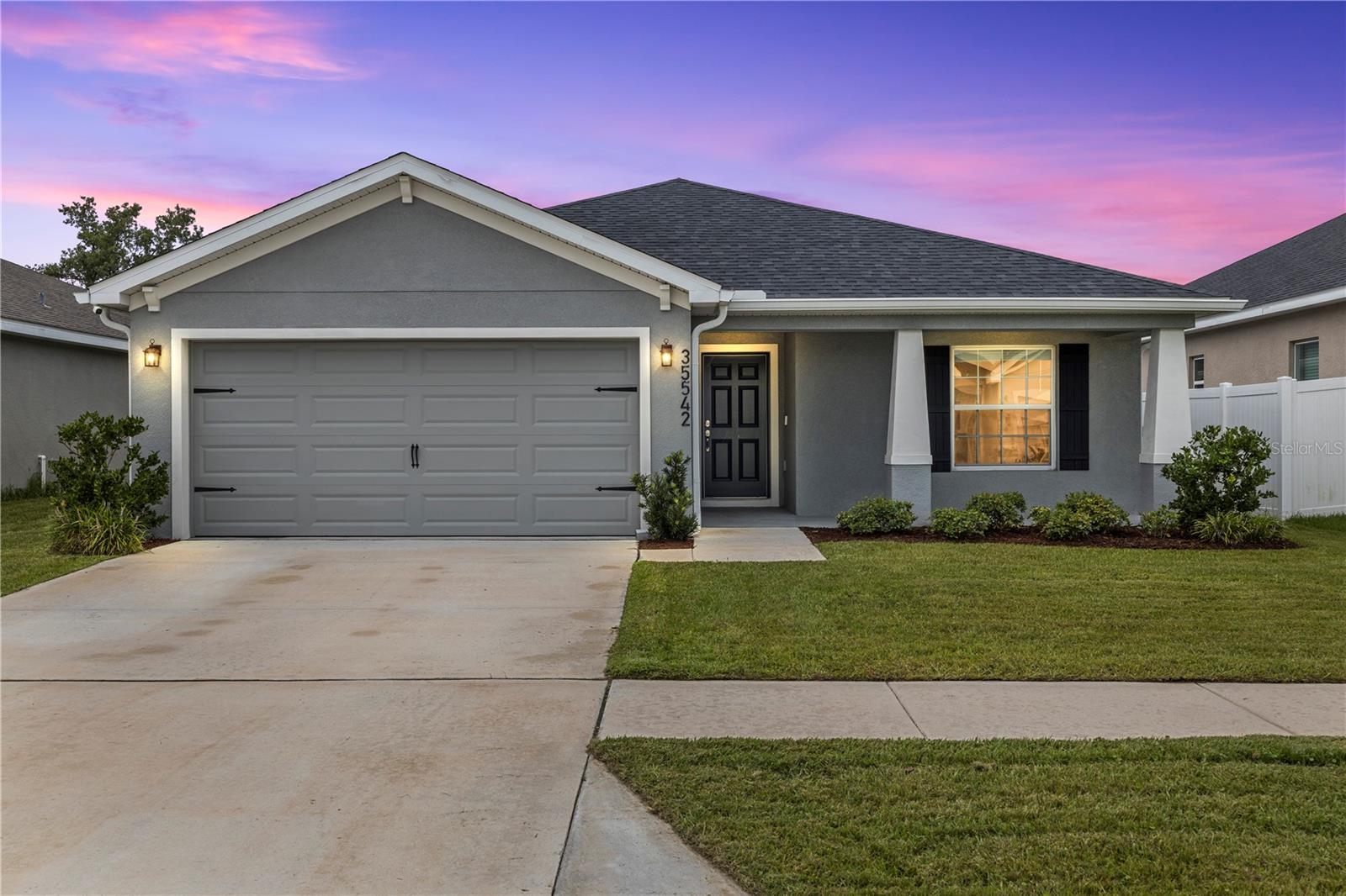 Built in 2024! This four-bedroom, two-bathroom home with an attached two-car garage is located in a non-flood zone and offers peaceful pond and conservation views with added backyard privacy. Inside, vaulted ceilings and an open floor plan connect the spacious living room, dining area, and kitchen, creating a comfortable layout for everyday living and entertaining. The kitchen features a breakfast bar, ample storage, and a walk-in pantry, while sliding glass doors in the dining area provide easy access to the backyard. The primary suite includes a private en-suite bathroom with dual sinks, a walk-in shower, and a garden soaking tub. Three additional bedrooms share a full bathroom with a tub and shower combination. The low-HOA community features sidewalks, a community swimming pool, and a playground. Conveniently located near State Road 54, Highway 301, and Interstate 75, this home offers an open layout, water views, low HOA fees, and easy access to shopping, dining, schools, and major roadways in the growing Zephyrhills area.