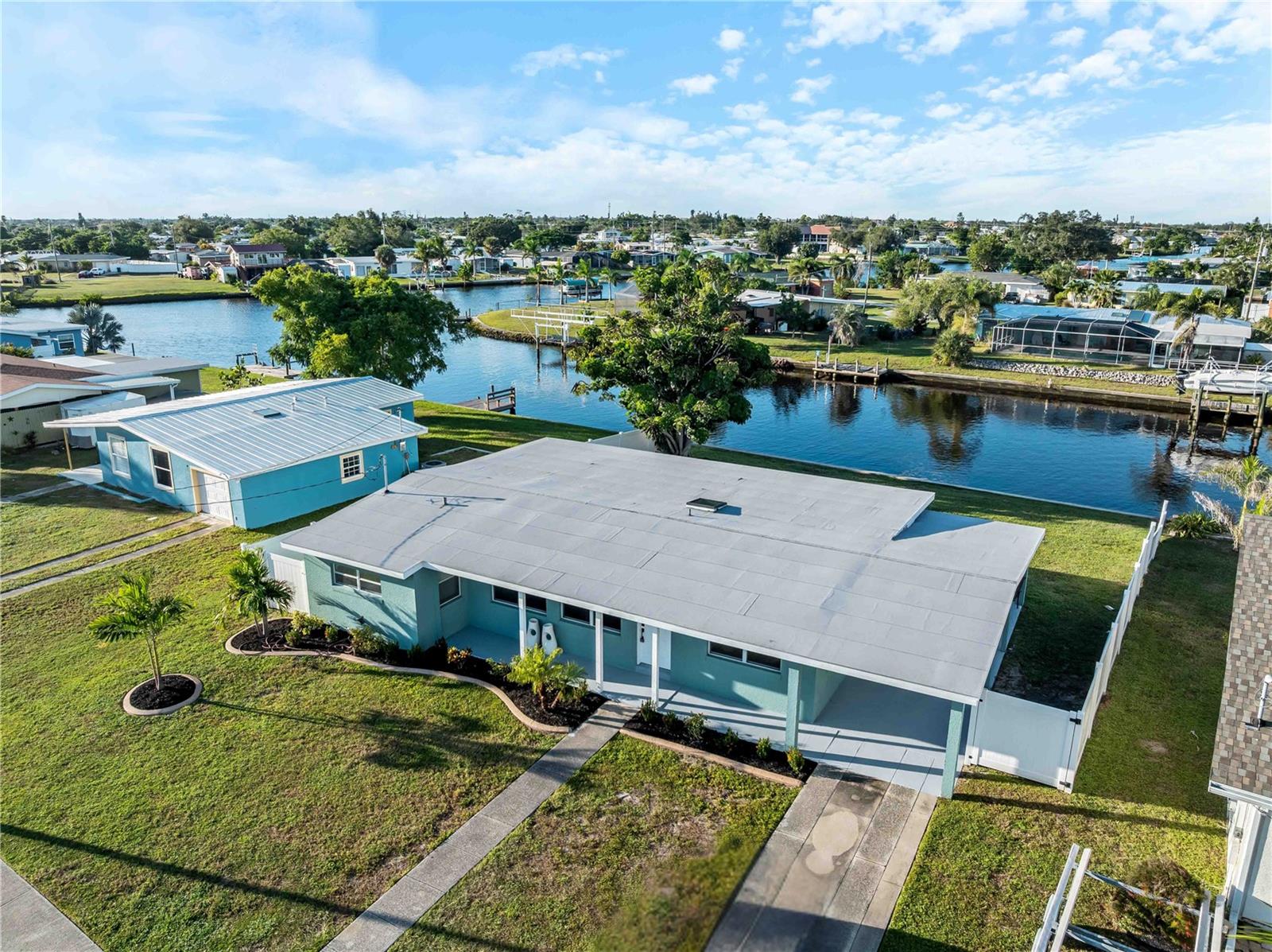Beautifully renovated and move-in ready, this 4-bedroom, 2-bath waterfront home combines modern updates, comfortable living spaces, and quick boating access to create the Florida lifestyle you've been looking for. Move right in and enjoy a thoughtfully updated interior paired with inviting outdoor spaces designed for relaxing and entertaining.

Step inside to a welcoming 19' x 10' living room, while the spacious 28' x 11' family room offers plenty of room to gather with loved ones. The dining area opens to the living room, making it easy to enjoy everyday meals or entertain guests.

The updated kitchen features quartz countertops, stainless steel appliances, and contemporary finishes. Four comfortable bedrooms are complemented by two tastefully renovated bathrooms. An inside laundry room, convenient mud room, and deep two-car carport add comfort and practicality to daily life.

Step outside to a 24' x 12' paver patio overlooking the canal—the perfect place to enjoy your morning coffee, unwind after a long day, or spend time with family and friends. The concrete seawall features a new cap, providing a durable waterfront edge for fishing or the future addition of a dock.

Boaters will appreciate approximately 1.28 miles to open water with just one bridge along the route, offering an estimated 10-foot clearance. From there, enjoy access to more than 120 square miles of navigable waterways in Charlotte Harbor, along with the Peace and Myakka Rivers, providing exceptional opportunities for boating, fishing, and exploring Southwest Florida by water.

Seller will consider contributing toward Buyer's closing costs, subject to offer terms and negotiation.