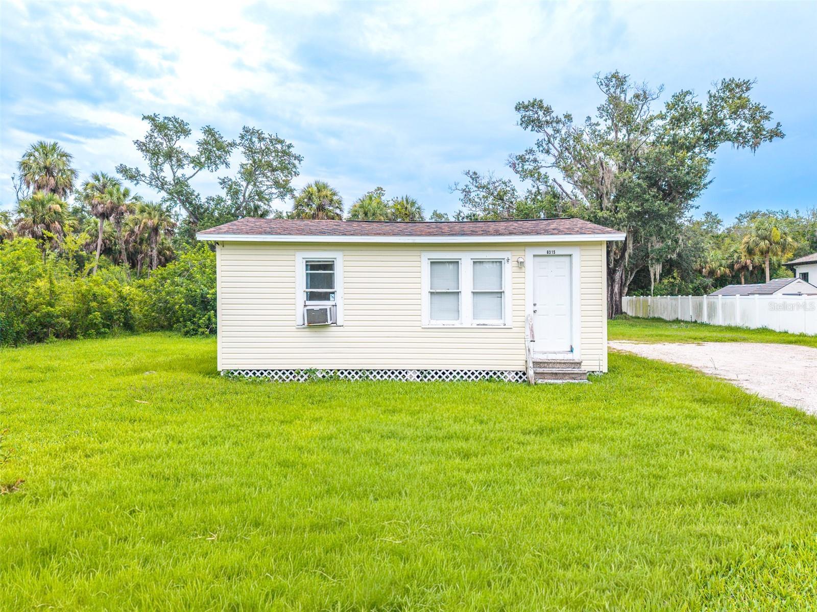Virtually Staged. Opportunity awaits on this oversized 0.41-acre lot in the heart of Town ‘N’ Country! Featuring a new roof installed in 2024, this unique property offers endless possibilities whether you’re looking to renovate, expand, or build your dream home. The existing home provides a great starting point, while the spacious lot offers ample room for outdoor living, future additions, or other possibilities (subject to county approval).

Additional updates include a water heater that is approximately five years old, and the septic system was pumped approximately three years ago, providing added peace of mind. Conveniently located near shopping, dining, Tampa International Airport, major highways, and Gulf Coast beaches, this property combines space, location, and opportunity. Bring your vision and make this special property your own!