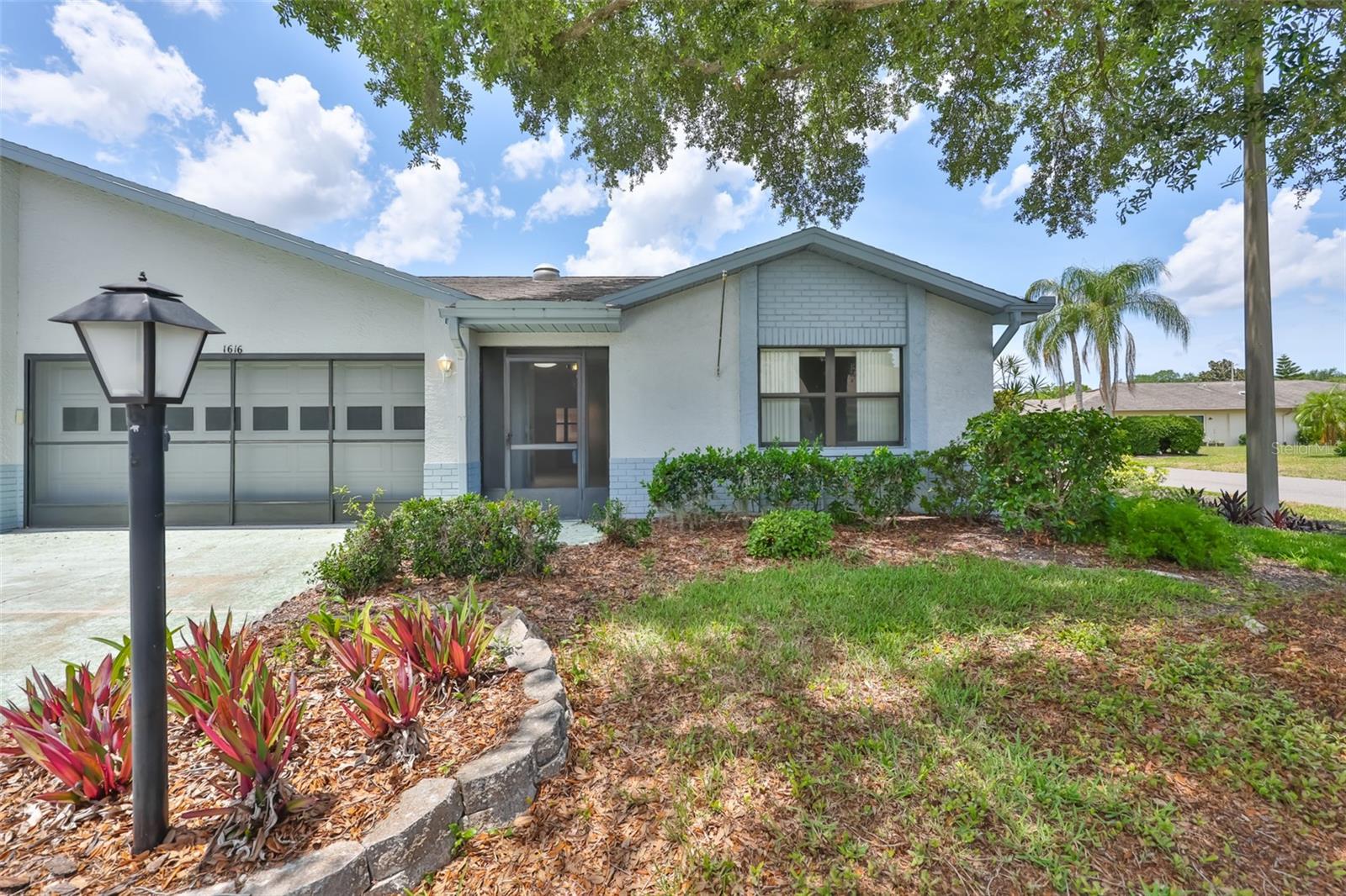 One or more photo(s) has been virtually staged. This Expanded Somerset Model with a Large Screened Lanai Plus NEW Carpet in the living room and two bedrooms.  Solar Tube for added light, plumbing is CPVC.  Enjoy maintenance free living with the monthly fee covering, the roof replacement, pressure washing and painting the exterior, insurance on the building, water/sewer, cable TV with two cable boxes one of which is a DVR, wireless internet, pest control, watering the lawn, cutting the grass, trimming the shrubs, gated community with 24 hour guard coverage.    Kings Point offers numerous choices for your ACTIVE lifestyle. Between the South Clubhouse and North Clubhouse and the 20/20 Centre Fitness/Spa building, there is pretty much something to do whatever your interests/hobbies. Pickle ball and tennis courts, Lawn Bowling, Indoor and Outdoor Pools, Spas, Veteran's Theater for live Entertainment, bingo, arts and crafts, variety of card clubs, wood working shop, stained glass studio, pottery, lapidary and different dining options, to name a few. AND, Kings Point is fully accessible in a golf cart 24 hours a day. Time for living the good life! Welcome to your new home