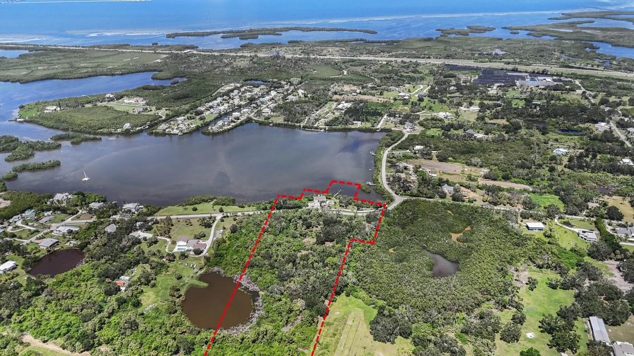 Welcome to Mariner’s Retreat, an extraordinary waterfront estate and development opportunity in the heart of historic Terra Ceia, Florida. Nestled along more than 475 feet of pristine shoreline on Tillette Bayou and Terra Ceia Bay, this rare Old Florida sanctuary spans approximately 9.64 acres across three parcels, offering a seamless blend of private coastal living and investment-grade potential. Anchoring the estate at 1470 Bayshore Drive is a meticulously updated, three-story residence encompassing over 3,600 square feet under air with a brand new roof. Renovated in 2018, the home features impact-rated windows and doors, an updated kitchen and baths, new flooring and lighting, and a 2023 HVAC system. Mangrove trimming is underway to enhance sweeping water views—all the way to the iconic Sunshine Skyway Bridge. From the private dock, enjoy direct boating access to Terra Ceia Bay and the Gulf of Mexico within minutes. Whether it’s world-class fishing, dolphin sightings, or tranquil sunset cruises, life here flows with the rhythms of the water.

Beyond the residence, the offering includes two development parcels across the street—1450 and 1460 Bayshore Drive—totaling over 8 acres of upland terrain with mature Florida landscape. Supported by a completed environmental study, these parcels offer the potential for additional homesites to be built under Planned Development Residential (PD-R) zoning and a RES-1 land use designation. Specifics available upon request. The entire estate falls within Flood Zone AE, with base elevations of 9 to 10 feet, and offers flexible acquisition options, including the ability to purchase the entire estate or individual parcels. Owner financing may be considered for qualified buyers along with additional information and environmental reports.

Mariner’s Retreat presents a rare opportunity to own a legacy estate that captures the timeless charm of Old Florida, while offering unique potential for future development or multi-generational living. All within easy access to St. Petersburg, Tampa, and the I-275 corridor—yet worlds away from the ordinary.
