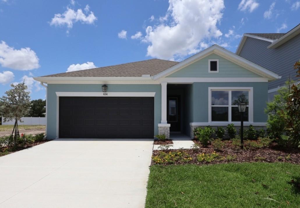 Discover a beautifully crafted new home by award-winning builder David Weekley Homes in Eastlyn, a boutique community in desirable Bradenton, FL. Residents enjoy low HOA fees, no CDD fees, and an exceptional location directly across from Gene Witt Elementary School with convenient access to Lakewood Ranch, I-75, UTC Mall, shopping, dining, entertainment, Gulf Coast beaches, and everyday conveniences. Plus, enjoy the peace of mind that comes with David Weekley Homes' industry-leading 1-2-10 Builder Warranty.
The thoughtfully designed Sanborn floor plan offers the perfect blend of style and functionality. This one-story home features an open-concept layout with rich wood-look flooring throughout the main living areas, a designer kitchen with 42-inch painted cabinetry, a contrasting navy island, quartz countertops, a designer tile backsplash, and a spacious family room that flows effortlessly to the covered lanai for seamless indoor-outdoor living. The private Owner's Retreat is tucked away at the rear of the home and includes a spa-inspired bath with an upgraded super shower and a generous walk-in closet. Two secondary bedrooms, a full bath, and an enclosed study with French doors provide flexible space for guests, a home office, or hobbies. Finished in a soft coastal-inspired color palette with elevated designer finishes throughout, this home offers timeless style and everyday comfort.