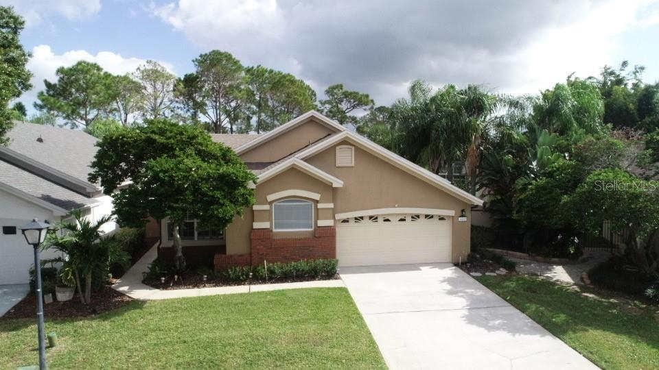 Click the  link on Virtual Tour 1 to view a completed 360 degree virtual tour of property! Immaculately maintained 1-story home.  No rear neighbors, picturesque view of green areas/golf course.NEWER ROOF (Feb. 2021).  NEWER AIR CONDITIONING SYSTEM(July 2022) Located in the guarded gated community of Tanglewood.  Spacious open floor, almost 2,000 sq. ft of living. Uograded flooring throughout home, Wood and ceramic tile.  Spacious kitchen includes complete Stainless Steel appliance package.  Washer and dryer in laundry room convey as well.  Spacious screened room overlooking private golf course views. Nice sized family room adjacent to kitchen.  Dining and living rooms are spacious and provide a nice flow throughout the property. Fenced back yard, paver walkways on entire exterior of property, oversized 2-car garage and more.  Community features abound including Community pool with spa, recreation/entertainment area, tennis courts and more. Guarded gated community including maintenance of your front lawn, sprinkler water and more.  Low maintenance living!  Enjoy the Hunters Creek lifestyle, including access to 7 different playgrounds, basketball courts, soccer and baseball fields, pickleball and tennis courts, tot lots , nature paths and more.  Ideally located near shopping, all major arteries, theme parks and International Airport.