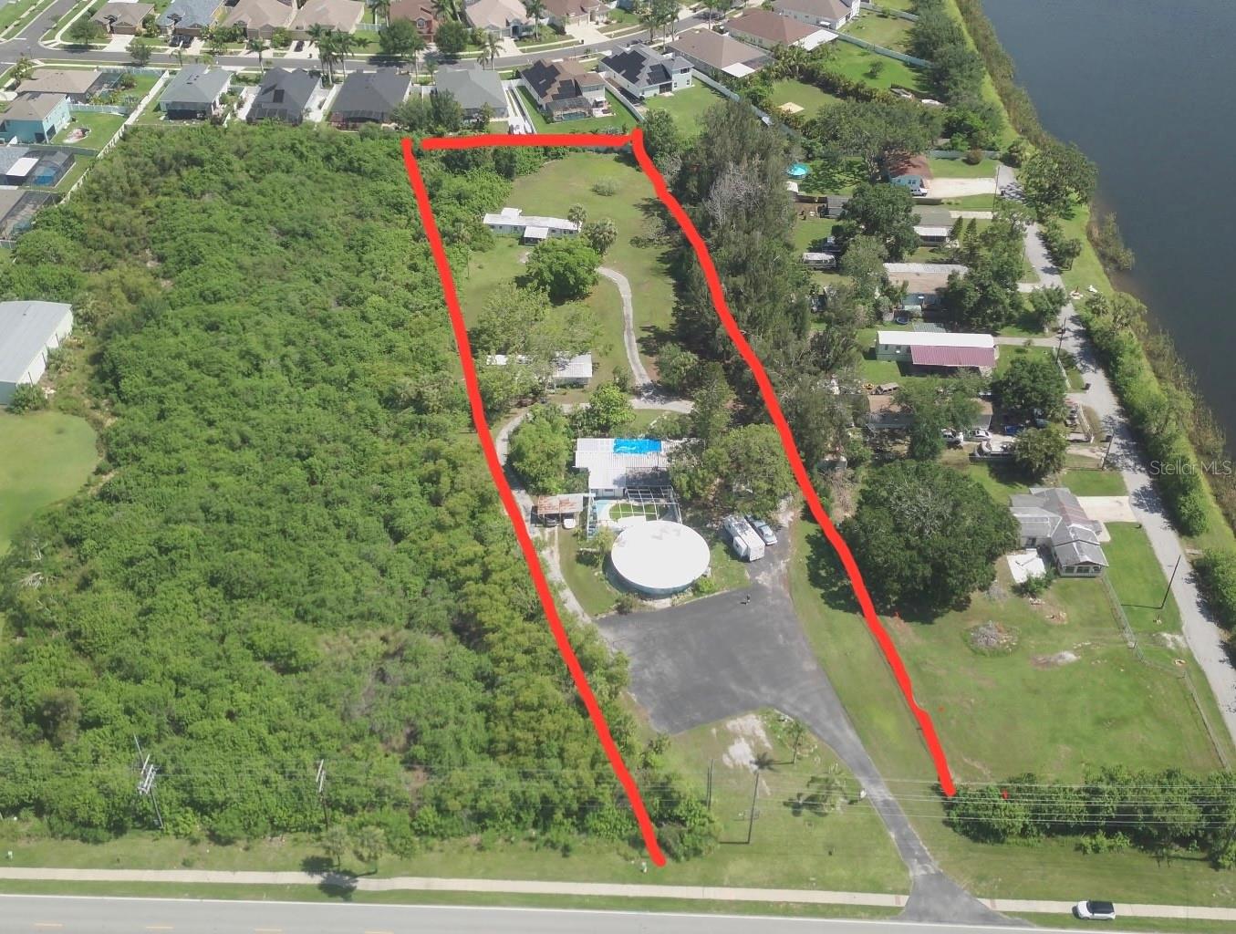 ALMOST 3 ACRES! VALUE IN THE LAND! 4 BUILDINGS IN GREAT NEED OF REPAIRS. FEMA HAS A 3 YEAR FLOOD INSURANCE THAT IS TRANSFERABLE AT CLOSING TO NEW BUYER. POOL IS NESTLED IN REAR OF 1ST BUILDING. 3 MOBILES THAT FLOODED EACH WITH OWN ELECTRIC POWER AND SEPTIC TANKS. WATER IS FURNISHED ON ONE METER COUNTY WATER PLUS A WELL. COMMERCIAL MIXED USE ON FRONT PARCEL, REAR IS AR.PICTURE YOUR BUSINESS HERE, LENDS ITSELF TO MOBILE HOMES, ALL FACTS TO BE VERIFIED BY BUYER. SURVEY IS FROM YEARS AGO. A STRIP OF LAND ALONG NORTH BOUNDARY WAS SOLD TO THE SUBDIVISION BEHIND PARCEL, SO SURVEY NEEDS TO BE REDONE. PEACE AND QUIET, NO INTERSTATE NOISE JUST MADE FOR YOUR BUSINESS AND HOMES. PLEASE CALL AND I WILL BE HAPPY TO SHOW. APPOINTMENT NEEDED AS FAMILY STILL LIVES HERE! NEW SURVEY NEEDED TO VERIFY EXACT MEASUREMENTS.