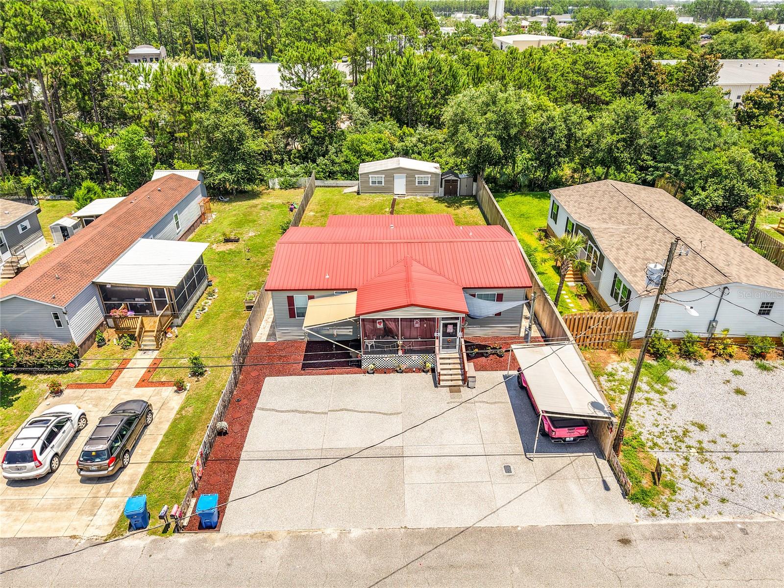 Welcome to Panama City Beach's highly sought-after West End, where coastal living meets investment potential. Just a 5-minute walk from the sugar white sands and emerald waters that have made Panama City Beach famous as one of the most beautiful beaches in the world, this meticulously maintained 2021-built 3-bedroom, 2-bath home offers the perfect opportunity for a primary residence, vacation getaway, or short-term rental investment. Approved for short-term rentals and offered with no HOA restrictions, this property provides the flexibility buyers are looking for in today's market. From the moment you arrive, you'll appreciate the oversized maintenance-free coated concrete driveway with ample space for multiple vehicles, boats, RVs, trailers, and recreational equipment. Two covered awnings provide additional shaded parking, while the fully fenced property offers privacy and security. Outdoor living is a true highlight with huge screened front and rear porches featuring durable marine-grade carpeting designed for easy cleaning and maintenance. After a day at the beach, enjoy the convenience of two outdoor showers before relaxing in your private outdoor space. The property also features low-maintenance rubber mulch landscaping, brick paver walkways, dual irrigation systems, storage access on both sides of the home, and heavy-duty lattice screening around the porches. One of the property's standout features is the massive 12x28 shed complete with electric, water access, storage space, and a wheelchair-accessible ramp. Originally planned as a future guest suite or rental space, this versatile structure offers endless possibilities for storage, hobbies, a workshop, or future expansion. Additional improvements include a new shingled roof enhanced with a metal roof system for added durability and weather protection. The backyard offers plenty of room to add a future pool, creating the ultimate beach retreat. Pride of ownership is evident throughout, with the home maintained in immaculate condition. The stove and dishwasher have never been used, no shoes have been worn inside the home, and most furnishings are available for purchase separately, making this an easy turnkey opportunity. Conveniently located near Scenic Highway 30A, Pier Park, shopping, dining, entertainment, and some of Florida's most breathtaking beaches, this exceptional property combines location, flexibility, and value in one of Panama City Beach's most desirable areas. Call today to schedule an appointment!