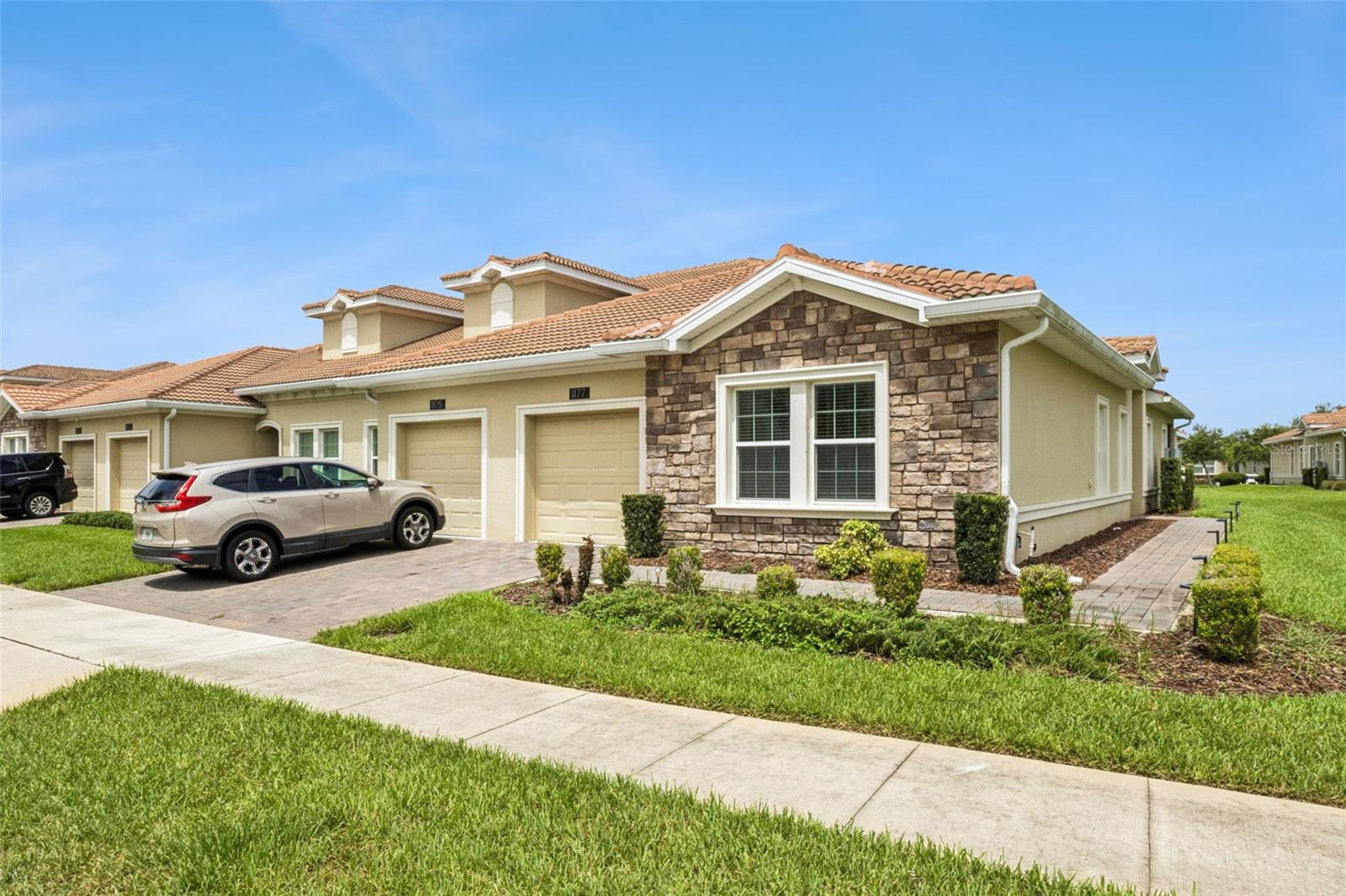 Stunning Corner Villa in ChampionsGate Golf Community
Welcome to this charming 2-bedroom, 2-bath corner hometown, built in 2020, and located within the highly desirable guard-gated golf community of ChampionsGate. Ideally situated near the North Community Pool, this beautifully maintained home offers comfort, convenience, and access to an unparalleled resort-style lifestyle. Freshly painted and featuring brand-new carpet, this move-in-ready home is ready for its next owner.
Inside, you'll find a thoughtfully designed floor plan featuring a luxurious primary suite with a spacious walk-in closet, dual vanities, and an oversized walk-in shower. A generously sized secondary bedroom and full bath provide comfort for family and guests, while the versatile FLEX ROOM CAN BE easily serve as a THIRD BEDROOM, home OFFICE, playroom, or hobby space.
The heart of the home is the beautifully appointed kitchen, complete with a charming breakfast nook and open-concept living and dining areas designed for everyday living and entertaining.
Living in ChampionsGate means enjoying exceptional amenities, including:

The Oasis Club with a resort-style pool, fitness center, tiki bar, cabanas, game room, and movie theater
The Plaza Clubhouse featuring its own pool, restaurant, game room, and fitness center
The Retreat Club offering a water park and additional dining options
Championship golf and premier recreational facilities throughout the community

The HOA includes:

Golf membership
Access to The Oasis Club and The Plaza Clubhouse
Lawn and landscape maintenance
Basic cable and internet
And more

Located on 1177 Trappers Trail Loop in Davenport, just off I-4 and only minutes from Walt Disney World Resort, this home is also conveniently close to Four Corners Charter School (9–12), Westside K-8, shopping, dining, and major highways.
Whether you're looking for a primary residence, vacation home, or investment opportunity, this exceptional ChampionsGate villa offers an outstanding combination of location, lifestyle, and value. Don't miss your chance to make it yours!