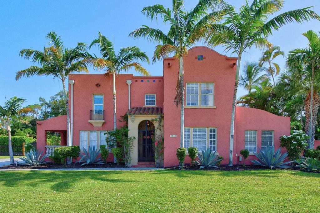 Historic charm, resort-style outdoor living, and flexible modern space come together beautifully in this 1927 Spanish Mediterranean home located in the highly sought-after Palma Sola Park neighborhood. Known as one of the first homes ever built in the area, this residence offers a rare opportunity to own a true piece of local history while enjoying the comfort and functionality today’s lifestyle demands. Set on an expansive, fully fenced 27,922-square-foot lot, the property feels like a private retreat from the moment you arrive. Mature tropical landscaping, a massive mango tree, a well-supported irrigation system, and generous green space create a lush, peaceful setting with room to entertain, play, garden, relax, or simply enjoy the Florida lifestyle. The backyard is a standout, featuring a large 30x20 private pool, a pool heater, a cozy back porch, and plenty of space for gatherings large or small. Inside, the home is filled with character and warmth, including restored original hardwood floors, beautiful natural light, and classic architectural details that honor its Spanish Mediterranean roots. The main level offers multiple living spaces, including a formal living room, formal dining room, and inviting sunroom with French doors. The kitchen and sunroom feature refurbished Spanish tile flooring, while the kitchen also includes freshly painted cabinetry with updated hardware. New custom blinds throughout the main level and freshly painted baseboards and trim across the property add a clean, refreshed feel. With 4 bedrooms, 3.5 bathrooms, and 2,320 square feet of living space, the layout offers both charm and flexibility. Upstairs, the primary bedroom spaces are thoughtfully arranged with bright windows, original details, and comfortable separation. One bedroom sits on the west side of the home with a built-in closet and nearby full bath, while two additional bedrooms are located on the east side with a full bathroom between them, complete with a jetted garden tub for relaxing at the end of the day. The detached two-car garage adds even more versatility, along with a completely renovated mother-in-law suite featuring its own full bathroom and new French doors. Whether used for guests, extended family, a private office, creative studio, poolside retreat, or additional living flexibility, this space is a valuable extension of the property. The garage and suite also feature a new roof, with gutters added to the mother-in-law suite for improved function. Additional detached storage and utility space provide room for tools, lawn equipment, hobbies, or a future workshop. From the original hardwood floors and Spanish tile details to the private pool, oversized backyard, renovated guest suite, and historic neighborhood setting, this Palma Sola Park residence offers a special blend of character, space, and Florida living that is difficult to duplicate.