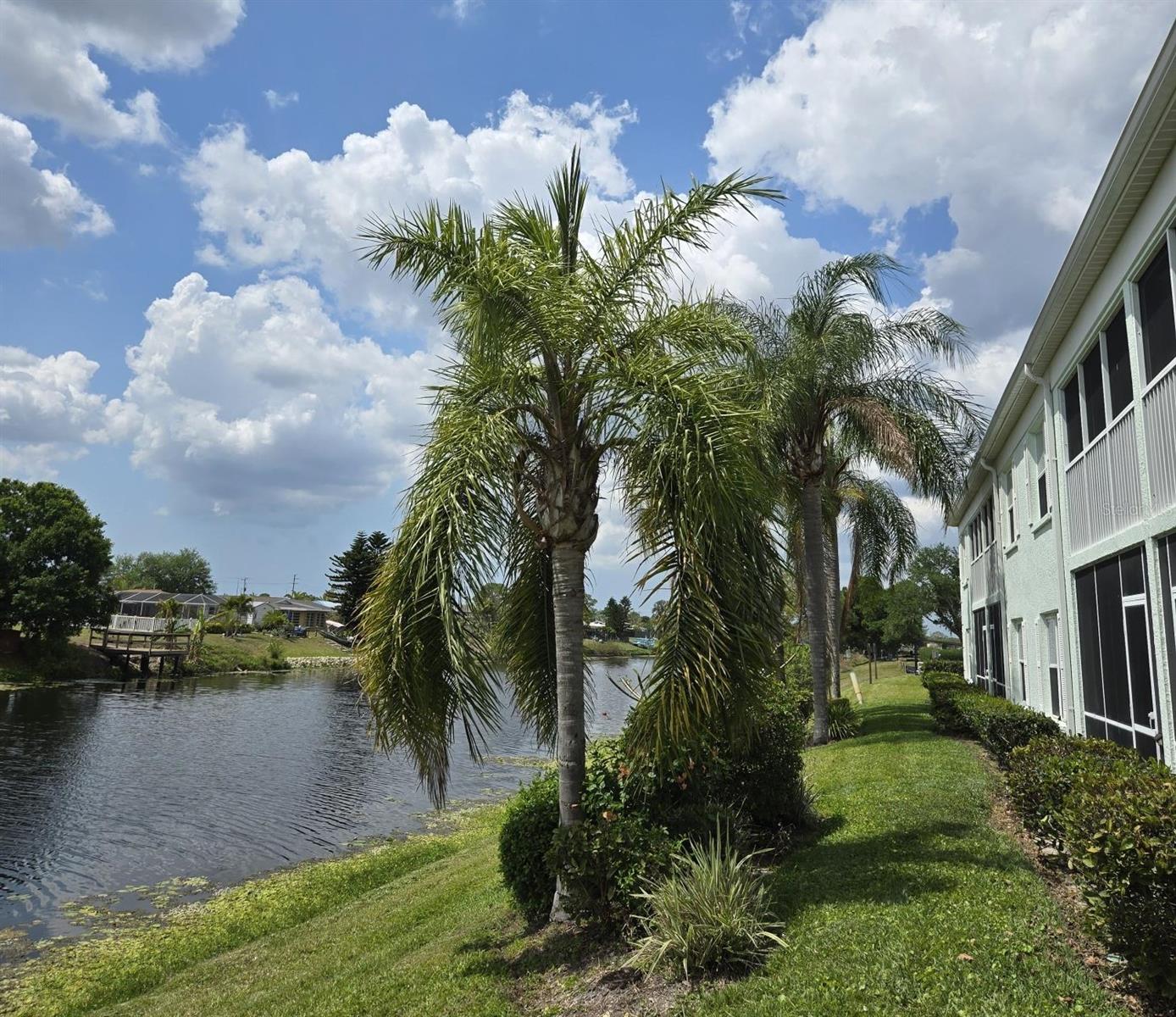 LOVELY WATERFRONT TWO BEDROOM - TWO BATH CONDO  - LOW LOW LOW HOA! IN HIGHLY DESIRABLE COCO PLUM 55+ COMMUNITY.
This immaculate and beautifully appointed home with SPECTACULAR water views features:
**Florida style decor with vaulted ceilings;on second floor - so no noise overhead; 
**All lights, ceiling fans, switches, hardware, baseboards have been updated;  
**Blackout curtains throughout;
**Cozy breakfast nook for two overlooking green space Bar-B-Q area;
**Long breakfast bar seats four with custom tile work, foot-rail & quartz countertops in kitchen;
**Built-in TV and stereo center with custom LED lighting in large living room;
**Dining & entertainment area is by the lanai and has a custom-built bar with wine cooler;
** Split Bedroom floor plan;
**Master Bedroom (with en-suite bath) has views of the waterway;
**Second Bedroom (with en-suite guest bath) has views of the grassy picnic area;
**Both full baths have porcelain sinks, wood vanities & one-unit Kohler commodes;
**Pet-free home but COMMUNITY IS PET FRIENDLY up to 15 lbs;
** NON-SMOKING current owners! 
**Sparkling blue HEATED community pool, long enough for laps, with bathroom, tables, chairs and loungers;
**Covered designated parking;
**Roof was replaced in 2023;
**LOW LOW LOW HOA! ...only $277/month;
**55+ community, no renting - so no strangers coming & going year round.
Close to shopping such as Publix, Walmart, TJ Maxx, Ross, Hobby Lobby.
Plenty of restaurants such as Anna Maria Oyster Bar.
Outdoor activities - Wellen Park, Warm mineral springs, and next door is Dallas Park (volleyball, tennis, and a playground) with a launch pad if you want to kayak/canoe, boat or fish.
Don't forget the BEACHES just a short drive away.
Enjoy the Florida lifestyle in a relaxed low-maintenance condo. 
Perfect as a winter home!
Sit out in the lanai overlooking the water; enjoy your coffee in the mornings with birds singing, and the beautiful sunsets with a cocktail in the evenings. This lovely home could be your very own Oasis!