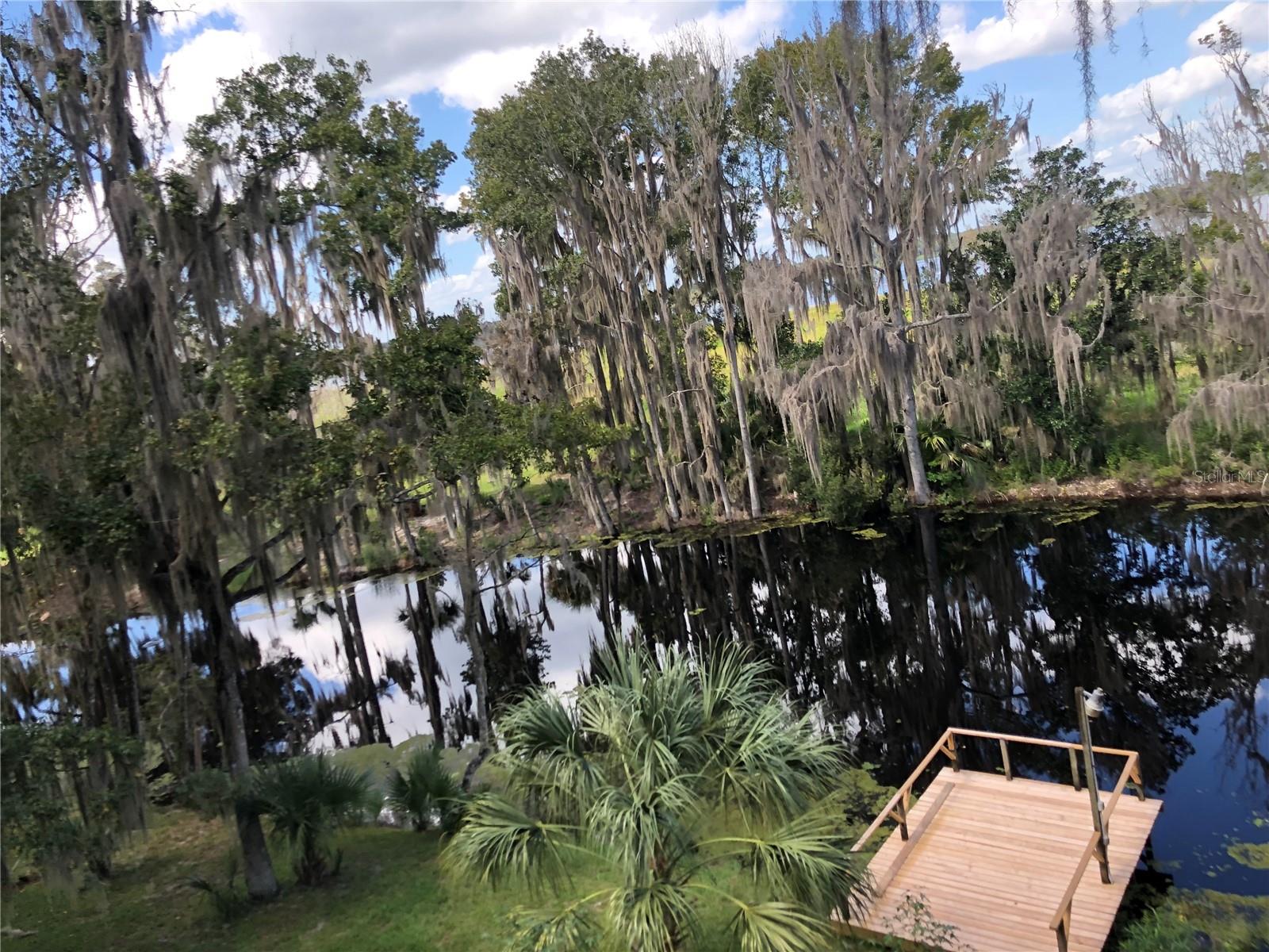 Serene Nature Retreat on 3 Acre Waterfront Property  – $147,000

Nestled on a sprawling 3 acre lot, this unique property offers the perfect blend of natural beauty and outdoor adventure. With 120 feet of cleared frontage on a tranquil canal that extends to Little Orange Lake, you'll have direct access to peaceful waters and stunning views. The canal frontage has a wooden dock that is perfect for fishing, relaxing, and soaking in the surrounding wildlife and serene atmosphere.

The property is shaded by an abundance of native Florida trees, including majestic oaks, palms, and striking magnolias, creating a lush, private oasis. Enjoy having a variety of fruit trees including orange, grapefruit, and persimmon trees.    Whether you’re enjoying the open wooden deck with canal and lake views or exploring the expansive grounds, you'll be surrounded by the beauty of nature at every turn.

The front 1 acre property has a perfect place to have your custom built home.  The property is also equipped with a well and septic system, adding to its appeal as a self-sufficient retreat. Irrigation system is an added feature to this thoughtfully designed property. Create a new homesite or embrace the minimalist living.  The property extends through the canal to cross over more land to additional lakefront property....let the adventure begin.

Located just a short drive from Gainesville, you’ll be able to attend all the University of Florida games and events, while still enjoying the peace and quiet of country living. With easy access to Ocala and Palatka, this property is ideally situated for those who enjoy a mix of outdoor recreation and urban conveniences.

Priced at $147,000, this is a rare opportunity to own a piece of Florida paradise. Don’t miss out on this waterfront gem!