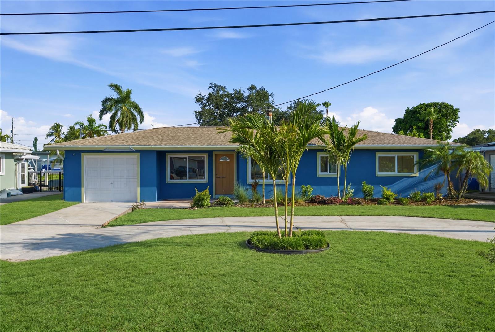 Experience elevated Florida waterfront living at this fully renovated residence in the highly sought-after Sun Plaza Isles community of Riviera Bay. Perfectly positioned on a deep-water canal with direct access to Tampa Bay, this stunning home seamlessly blends modern design with the boating lifestyle.

From the moment you arrive, you'll appreciate the lush tropical landscaping, circular driveway, and inviting curb appeal. Inside, you're greeted by an expansive open-concept floor plan filled with natural light, wide-plank luxury flooring, recessed LED lighting, and clean architectural lines throughout.

The heart of the home is the designer kitchen, featuring custom shaker cabinetry in a sophisticated coastal hue, quartz countertops, a dramatic oversized island with seating, stainless steel appliances, stylish pendant lighting, and abundant storage—creating the perfect space for entertaining or everyday living.

The spacious living and dining areas flow effortlessly together, with large sliding glass doors framing peaceful waterfront views and extending your living space outdoors. Every room has been thoughtfully updated with modern fixtures, contemporary ceiling fans, fresh finishes, and a bright, airy aesthetic.

The private primary suite provides a relaxing retreat, while the guest accommodations offer flexibility for family, visitors, or a home office. Beautifully renovated bathrooms showcase high-end finishes and timeless design.

Step outside to your own waterfront paradise. Whether you're relaxing on the patio, entertaining guests, or setting out for a day on the water, this property is built for the Florida lifestyle. Boaters will appreciate the two electric boat lifts, including a 10,000-pound cradle lift and an additional 1,850-pound davit lift, allowing easy access to Tampa Bay, Weedon Island, downtown St. Petersburg, local sandbars, and the Gulf beyond.

Additional exterior amenities include a fish cleaning station, outdoor shower, raised garden beds with reclaimed water irrigation, shuffleboard court, RV 50-amp electrical hookup, hurricane tie-downs, and a seawall replaced in 2010.

Recent improvements include a Trane HVAC system, updated plumbing, double-pane windows, tile roof, designer lighting, security system, rescreened lanai, fresh interior and exterior paint, and numerous additional upgrades that make this home truly move-in ready.

Located just minutes from downtown St. Petersburg, two neighborhood parks, a community boat ramp, restaurants, shopping, waterfront festivals, and easy access to the Gandy and Howard Frankland bridges, this exceptional property offers the perfect combination of luxury, convenience, and waterfront adventure.

This isn't just a home—it's a destination. Live where every day feels like a vacation.