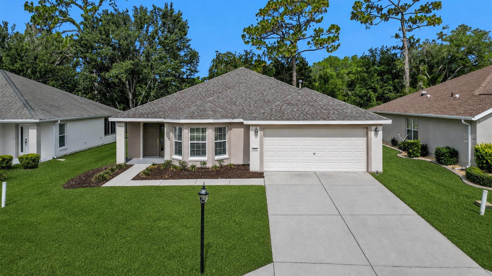 **Seller will either resod the front yard right before closing OR give a credit to the buyer. Welcome to Del Webb Spruce Creek Golf & Country Club, one of Central Florida’s premier gated 55+ communities (guarded 24/7), where resort-style amenities meet a vibrant, golf cart-friendly lifestyle. This beautifully updated home features an open and airy floor plan with new flooring throughout, fresh modern finishes, and a spacious living room highlighted by a sleek electric fireplace that creates a warm focal point for gathering and relaxing. The updated kitchen offers stylish cabinetry, stainless steel appliances, ample counter space, and overlooks a charming breakfast nook that serves as the perfect dining area filled with natural light. The spacious primary suite provides a peaceful retreat with dual vanities and generous closet space. The covered rear patio offers an ideal spot to enjoy your morning coffee or unwind in the evening overlooking the backyard. Natural light creates a bright and inviting atmosphere throughout the home.

Living in Del Webb Spruce Creek means enjoying an incredible array of amenities. Residents enjoy 36 holes of championship golf at Eagle Ridge Golf Club, a state-of-the-art 14,000-square-foot fitness center with an indoor lap pool, two heated outdoor pools and spas, tennis and pickleball courts, softball fields, bocce ball, walking trails, on-site dining, countless clubs and social activities, and year-round entertainment. Whether you're looking for an active lifestyle or a welcoming community with a true small-town feel, this home offers the best of both worlds.