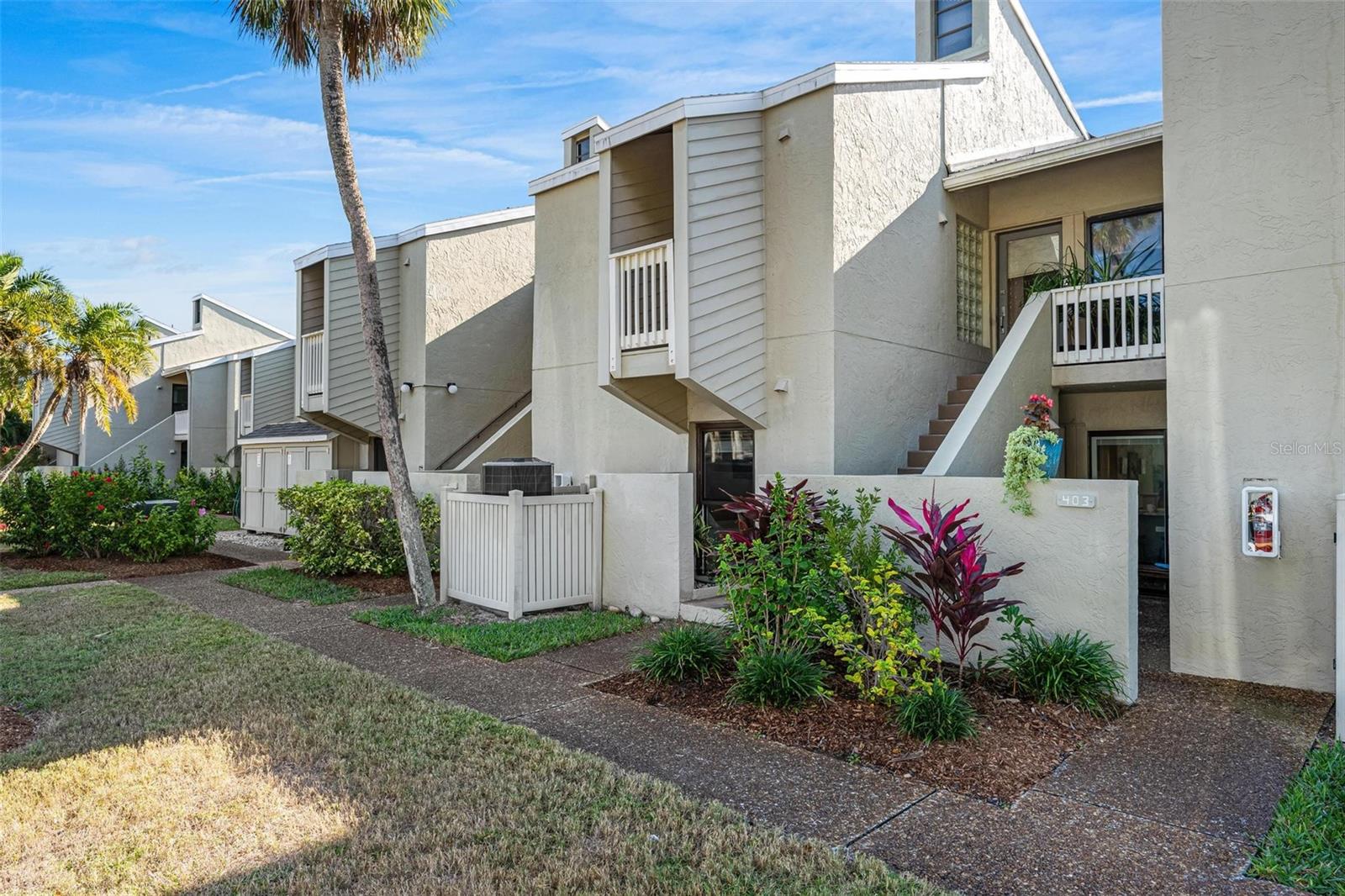 This beautifully maintained, ground-floor 2-bedroom, 2-bathroom condo in the desirable Banyan Bay Club offers an exceptional opportunity to own a spacious, modern / updated, move-in-ready home perfectly positioned in a charming, pet-friendly gulf-to-bay community. This unit combines convenience, amenities, and a relaxed coastal lifestyle—all at an outstanding location. This Banyan Bay condominium has an open floor plan with plank style ceramic tile throughout, recently updated featuring new cabinets, vanities, quartzite/quartz countertops and new stainless steel appliances; new Central Air system, and new hot water heater, in-unit full-size washer & dryer, modern tile design in bath, extra sleeping nook for added flexibility, tastefully furnished (can be sold furnished), private patio nestled under a majestic banyan tree-ideal for morning coffee or evening cocktails, large glass hurricane sliders & windows offering a garden view, fiber optic internet included for each unit. SQUARE FOOTAGE IN SLEEPING NOOK IS ADDED TO MAKE THE INTERIOR SQ FTG 1163. The resort-Style Community Amenities (steps from your door): heated community swimming pool, newly resurfaced tennis and pickleball court, fully equipped fitness center, clubhouse with social hall and full kitchen, new day dock, fishing pier, kayak/paddleboard launch, & storage, private gulf beach access with complimentary lounge chairs on the sand, assigned covered carport parking plus ample guest parking, exterior storage for beach gear, on-site manager and carefree exterior maintenance handled by the association, bicycle storage and mature tropical landscaping with giant banyan trees. Unbeatable Location-why Mid-Key is Best! Everything you need is within walking distance; numerous restaurants & cafes, boutiques, beautiful Durante Park with shaded trails and playground, 3 minute walk to your private Gulf beach, 1-minute walk to the community pool, gym, clubhouse, and courts,. This 44-unit condominium offers a social atmosphere, plenty of activities, up to 2 pets allowed (no weight or size limit). Whether you are seeking a full-time residence, vacation getaway, second home or investment property (valued returning renter’s incomes can offset HOA fees), this immaculate condo is ready for you to move in and start enjoying the island lifestyle today. Don't miss this combination of location, amenities and value on Longboat Key!