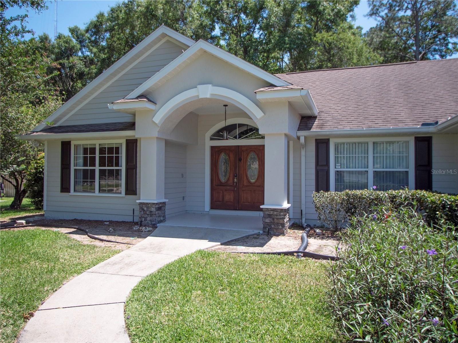 Beautiful 3 bedroom, 2.5 bath pool home situated on a spacious half-acre lot in quiet Summerbrooke neighborhood with a low HOA fee.  This inviting split bedroom floor plan offers comfortable living spaces, including a large family room with vaulted ceilings and a wood burning fireplace, separate ding area, and a spacious eat-in kitchen featuring warm wood cabinetry , granite counters with the laundry room directly off the kitchen.  The primary suite is generously sized and features a tray ceiling, large walk-in closet, private bath with dual vanities and a Soaking Tub.  Flooring includes attractive wood laminate flooring through-out most of the home, with tile and carpet in select areas.  Additional features include a side entry garage and an extra storage shed.
Enjoy Florida living outdoor with a screened in-ground pool and covered large lanai, out door grill area and attractive vinyl fencing surrounding the backyard.  With plenty of space inside and out, this home offers privacy, comfort and convenience in a desirable setting.  The roof was recently replace adding peace of mind for large ticket items, conveniently located near shopping, dining, medical and all that Ocala offers this is a beautiful property!