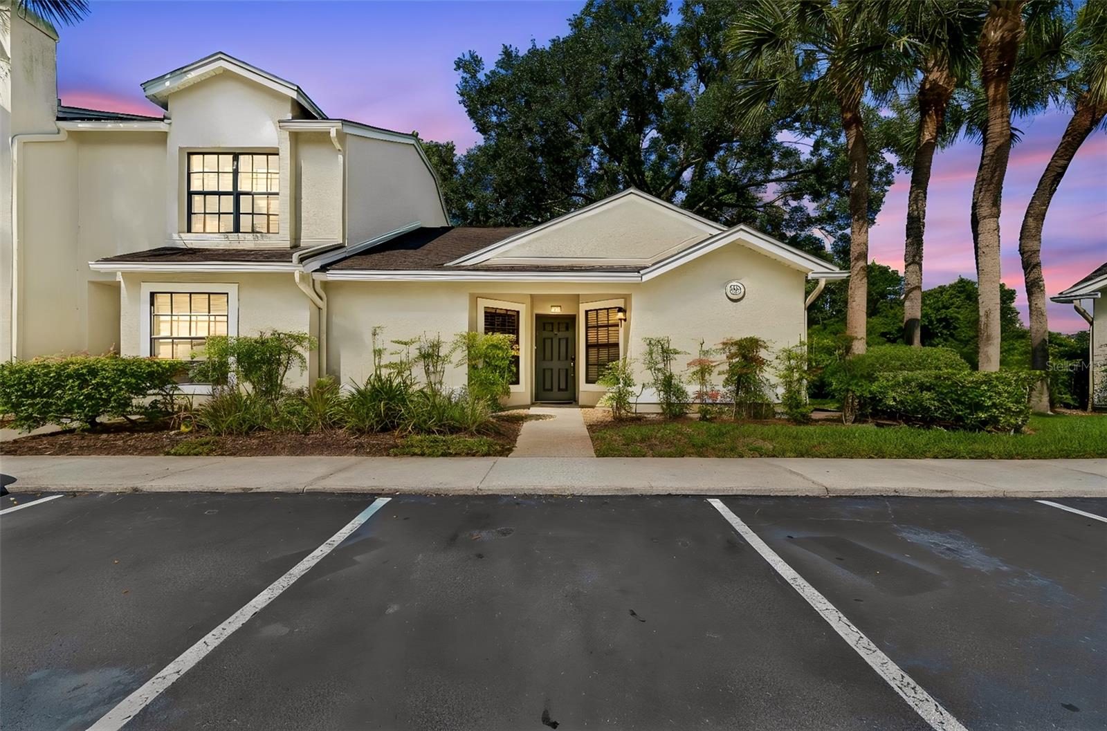Welcome Home to PEACEFUL CONSERVATION & POND VIEWS and the ease of MAINTENANCE-FREE LIVING in this STUNNING, MOVE-IN READY home in Tampa Palms! Nestled within the gated community of Faircrest, this beautifully updated single-story end-unit offers 2 bedrooms, 2 full bathrooms, and 1,020 square feet of thoughtfully designed living space surrounded by nature and convenience. Step inside and SOAK IN that bright, open feel created by soaring ceilings, abundant natural light, and stylish waterproof luxury vinyl flooring that flows throughout the main living areas. The REMODELED KITCHEN serves as the heart of the home, featuring updated NEW CABINETRY with SOFT CLOSE, QUARTZ countertops. modern gold finishes, stainless steel appliances, and a functional layout that keeps you connected to the living and dining spaces while enjoying tranquil POND VIEWS beyond. One of this home's most special features is its private rear setting. Enjoy peaceful conservation views from the family room and unwind in the breakfast nook while taking in SERENE WATER VIEWS — a perfect backdrop for morning coffee or a quiet evening at home. With NO REAR NEIGHBORS, the setting offers a rare sense of privacy and connection to nature. The spacious primary suite serves as a true retreat, complete with a beautifully REMODELED EN-SUITE bathroom featuring a large walk-in shower with frameless enclosure and contemporary finishes. The secondary bedroom is generously sized and conveniently located near the second full bathroom, making the floor plan ideal for guests or a home office. Additional updates provide peace of mind, including a 2020 HVAC system, 2022 water heater, stackable washer and dryer, and low-maintenance flooring designed for everyday Florida living. Faircrest residents enjoy a carefree lifestyle with grounds maintenance, water, sewer, and trash included in the low monthly condo fee. The community pool & fitness room is an easy walk away, while nearby Amberly Park offers shaded walking paths, playgrounds, open green space, and scenic views perfect for evening strolls. Residents enjoy access to 5 parks in Tampa Palms including Compton Park with incredible amenities including Junior-Olympic size heated pool, 3 tennis courts, 2 pickleball courts, playground, meeting facilities, and picnic areas.  Hampton Park provides additional tennis courts and covered playgound with pavilion and picnic areas. River Park & Oak Park provides the perfect place to connect with nature! River Park offers walking trails and scenic boardwalks along the Hillsborough River.  Ideally located near I-75 and I-275, you'll enjoy convenient access to hospitals, shopping, dining, downtown Tampa, Tampa International Airport, and everything that makes New Tampa one of the area's most desirable places to call home. Schedule your private showing today and discover the perfect blend of updated comfort, natural beauty, and maintenance-free living.