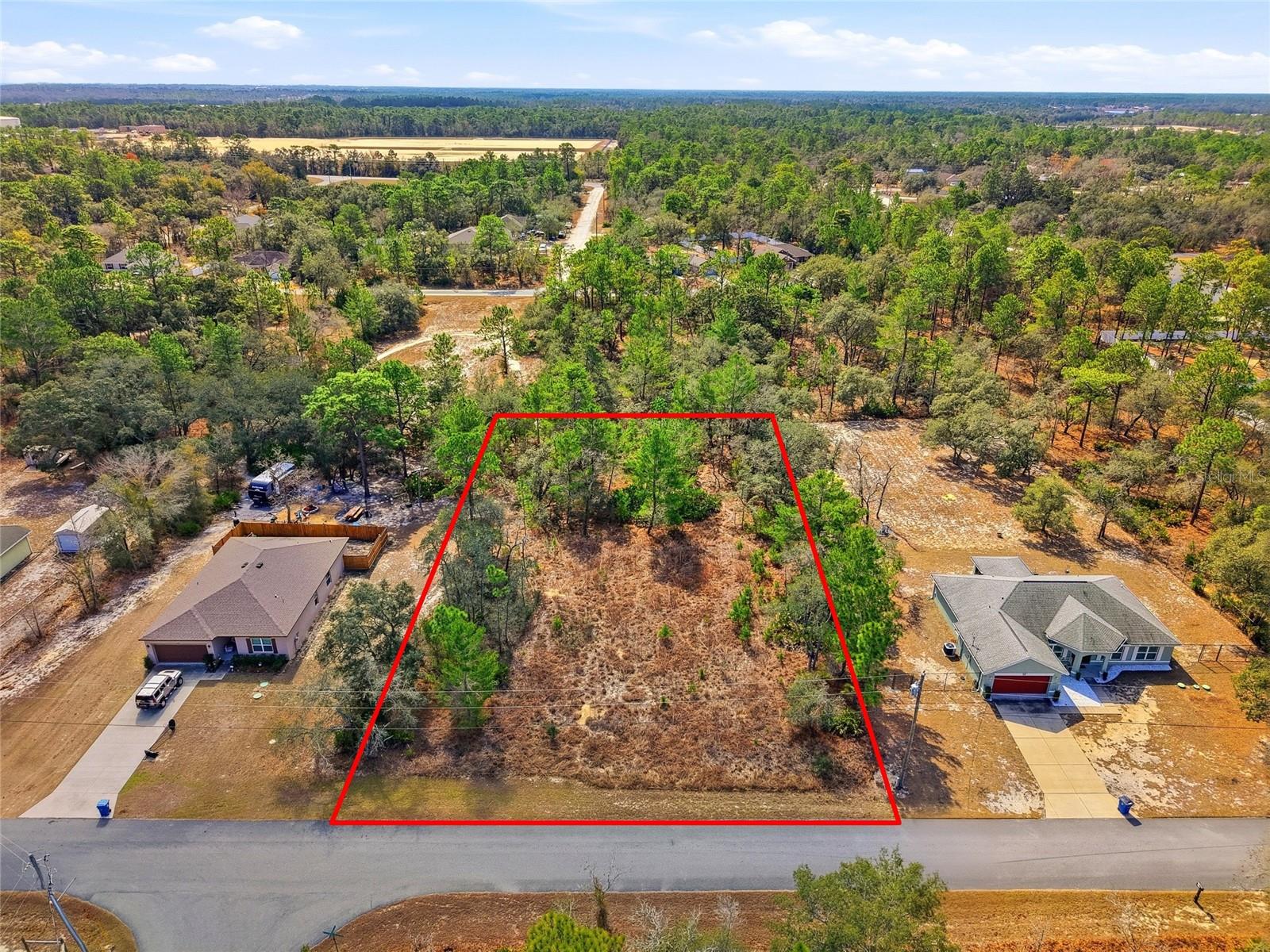 Build your Florida dream home on this spacious 0.75-acre homesite in the desirable Royal Highlands community of Hernando County. Located on a quiet street surrounded by custom homes and peaceful woodlands, this R1C-zoned (Single Family Residential) property offers the perfect blend of privacy, space, and convenience — with no HOA or CDD fees. The lot is situated in a high-and-dry area with nearby power access and a standard well and septic setup. Just minutes from US-19 and the Suncoast Parkway, you’ll enjoy easy access to shopping, dining, medical facilities, and the beautiful Gulf Coast beaches. Zoned for Winding Waters K-8 and Weeki Wachee High School, and close to HCA Florida Oak Hill Hospital, this location also places you near outdoor recreation including Weeki Wachee Springs State Park, kayaking, and scenic nature trails. Approximately one hour north of Tampa and about 20 minutes to the Gulf, this property presents an excellent opportunity to build your custom home or invest in one of Hernando County’s fastest-growing areas.