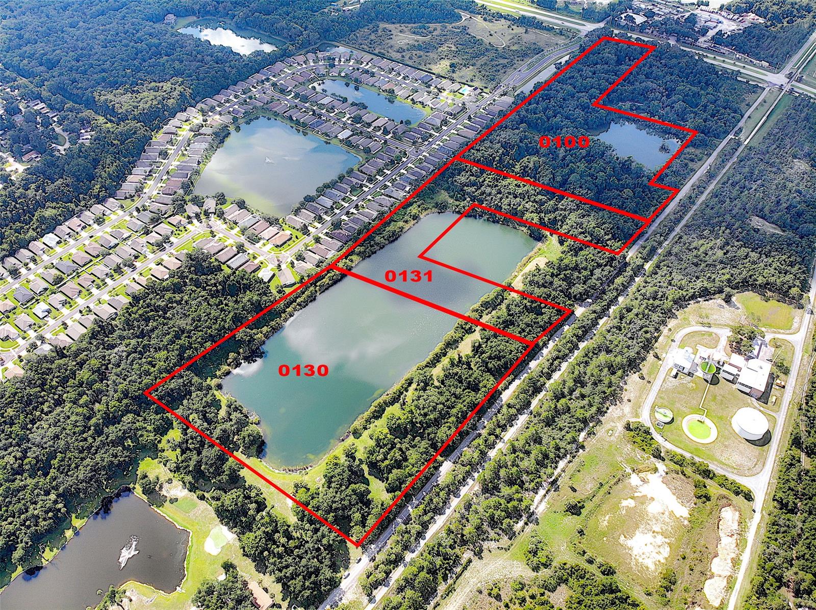 PERFECT FOR SOMEONE WITH A MOTOR COACH, ELECTRIC, WELL Includes 1531 Cow Creek Road, Parcel # 840500000131.  Property tax for both parcels for 2019 was $3,728.65 
Owner has used as private Florida retreat for years but has sold motor home. Terrific piece of property on approximately 22 acres including part of a lake! Lake is approximately 12.48+/- acres. Great development opportunity and zoned agricultural. Survey and area photos available see attached documents. There is a shell road leading to this property located just off the I-95 interchange on 442 leading into Edgewater. The state and county have recently approved acreage just to the west of this site for massive development, with homes, shopping, recreation, etc. The property is adjacent to the  Rails to Trails path. Excellent opportunity to acquire land that could have many uses such as homes RV park, etc. Beautiful lake serves as a centerpiece for this property. Currently there is only one home located on this section of the road and the road dead ends at this home. Easy exit and entrance to I-95, 4 lane highway from property to shopping and US 1. 20 minutes to Daytona and easy drive to the beach in New Smyrna Beach. Property is mostly cleared with wonderful large oaks scattered throughout this impressive acreage. The property is also in the center of the next growth area for both the city and the county. Surveys of the property and aerials are available along with information provided by both the City of Edgewater, Volusia County, and Department of Transportation. Adjacent landowners have expressed interest in being considered for inclusion in any plans for development. Property is in city of Edgewater, retains County Ag zoning, future city land use MU.; Cleared: Partial