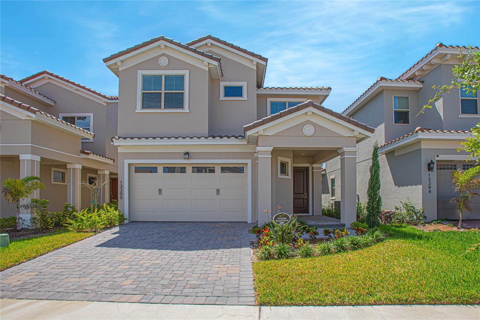 Virtually Staged. Welcome to this beautifully designed 2023-built home in the gated golf community of Eagle Creek. Featuring a Mediterranean-inspired elevation, tile roof, paver driveway, and covered front entry, this residence offers strong curb appeal, modern finishes, and a spacious layout designed for comfortable everyday living.

Spanning 3,180 square feet, the home features five bedrooms, four and one half bathrooms, and flexible living space across two levels. The main level showcases an expansive open-concept design with long-plank ceramic tile flooring, crown molding, and recessed lighting. The living and dining areas flow seamlessly into a spacious kitchen designed for both daily function and entertaining, featuring rich wood cabinetry, quartz countertops, a large island with seating, built-in double ovens, stainless steel appliances, a vented hood, and subway tile backsplash.

Sliding glass doors open to the covered patio and backyard, bringing in natural light and extending the living space outdoors. The first-floor primary suite offers privacy and convenience, complete with tray ceiling detail, a spacious walk-in closet, and a well-appointed bath with a tiled shower and double vanity. A functional layout connects the primary closet directly to the laundry room, which includes a sink and additional cabinetry.

Upstairs, a generous loft provides additional living space ideal for a media room, home office, or play area. The second floor also includes three additional bedrooms and two full bathrooms, along with a true second primary suite featuring its own private bath and closet, offering excellent flexibility for guests, extended family, or multigenerational living.

Built in 2023 with roof, AC, and water heater all from 2023, this home offers modern comfort and efficiency. The property is now vacant and move-in ready. Residents of Eagle Creek enjoy access to resort-style pools, clubhouse with fitness center, tennis and basketball courts, playground, and Eagle Creek Elementary located within the community gates, with golf course access available within the community.