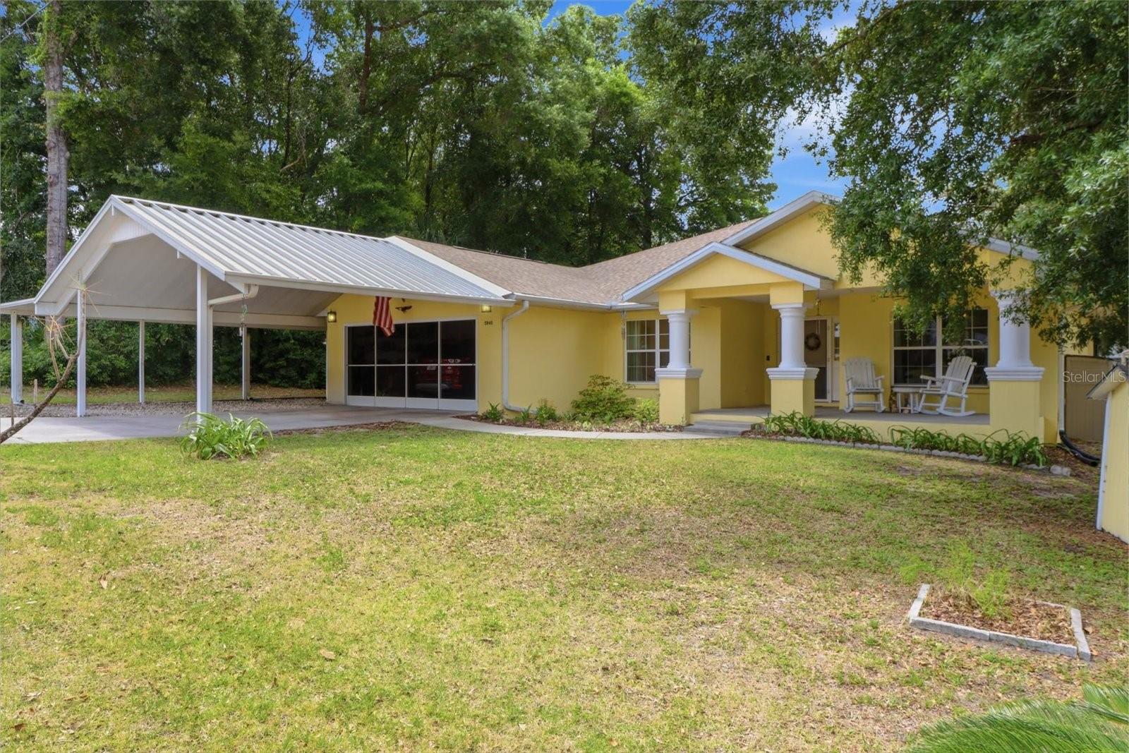 Packed with Extras & Move-In Ready in Popular Connell Heights! This beautifully maintained 3-bedroom, 2-bath split-bedroom home offers comfort, convenience, and room for all your toys! Featuring a double garage, double carport, plus an extended covered carport perfect for boats, RV storage, or extra vehicles, this property checks all the boxes. Major updates provide peace of mind, including a NEW roof (2025), NEW drainfield (2024), fresh exterior paint (2025), and yearly serviced A/C and heating system. Inside, enjoy luxury vinyl plank flooring throughout most of the home, updated lighting and fans, and double-pane tilt-out windows with built-in blinds. The spacious primary suite showcases an incredible newer walk-in shower that feels like a private retreat. Outside, you'll love the stunning mature landscape and beautiful oversized oak trees creating shade and curb appeal. Located in desirable Connell Heights and close to shopping, dining, and everyday conveniences. Perfect for family living or your retirement paradise—priced to sell quickly!