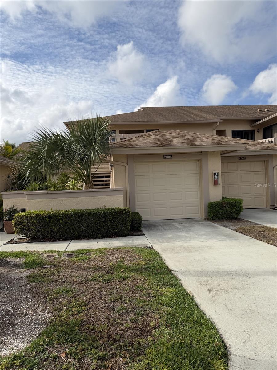 Welcome to easy, free living at 2004 Longpointe Cir #E-2, Venice, FL in this beautifully 2-bedroom, 2-bath condo with views in the Woodlake community of Venice! Tucked away in a quiet setting, this first-floor unit offers an open layout, abundant natural light, and peaceful views from your private enclosed lanai and even features a private garage! Step inside to discover a spacious and open layout with newer luxury vinyl plank flooring, a light-filled kitchen with ample cabinetry, pantry space, and a cozy eat-in area. A formal dining area also makes a great space for entertaining family or guests! The primary suite boasts serene water views and private lanai access through sliding glass doors and a gorgeous updated primary bathroom featuring a spacious tiled shower and large vanity and dual closets. With plenty of interior storage, a full-size washer and dryer located inside the unit, this unit is perfect as a full-time residence, seasonal getaway, or opportunity-leasing is allowed! Enjoy spending your time outdoors at the community's well-maintained and stunning pool and spa area or sitting along the dock overlooking the lake, join in on community events and also take advantage of this fantastic location which is close to parks, grocery stores, dining, shopping, and the beautiful Gulf Coast beaches.