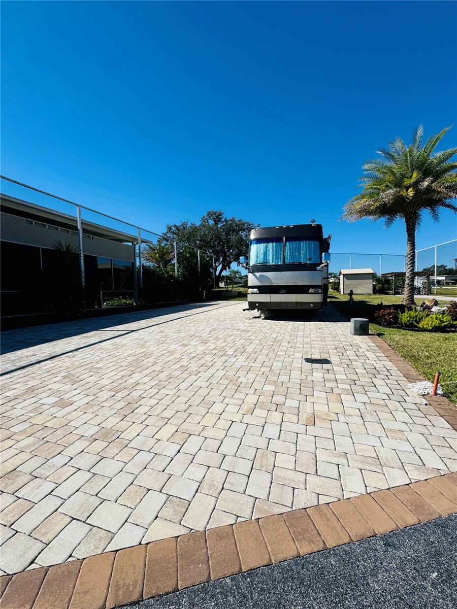 WELCOME TO DEER CREEK RV & GOLF COUNTRY CLUB!  Enjoy RESORT STYLE LIVING at its best at this 55+ Gated Oasis! Park your CLASS A MOTORCOACH on this PREMIER RV LOT in Regal Pointe located in Deer Creek Community!  Don’t have an RV? Build your new Florida Getaway here!  If you’re looking for the perfect spot to park your rig or a great spot to build in the sunshine state, this is it!  The 45 x 103.93 ft. lot boasts new pillow top pavers complete with full hook-up & 50-amp service with water available on two sides!  Beautifully landscaped & ready for your building plans or a great place to park your Class A Motorcoach!  You’ll love the 10 x 12 Smith Built Shed with electric to store your golf clubs & pool toys! Enjoy sipping your coffee or reading your favorite book overlooking the 13 hole on Deer Creek’s Golf Course! The Regal Pointe Community Clubhouse, Pool, Hot Tub, Fitness Center & many FUN activities are just a golf cart ride away!  If you love RESORT style living, this is the place for you!  Deer Creek Community has a MAIN CLUBHOUSE offering a variety of social events throughout the year such as Karaoke, Trivia, Cardio Drumming, Line Dancing, Crafts, Swing Dancing & more!  Soak up the sun at Deer Creek’s MAIN pool, cabana & hot tub area! Try water volleyball, pickleball, tennis, shuffleboard or pool aerobics!  Love golfing? Check out Deer Creek’s 18 Hole Executive Golf Course Leagues & shopping at the Pro Shop! The Tiki Bar or The Topside Tavern is a great place to meet new friends with occasional live bands & music! The Greenside Grill is perfect for onsite dining!  Deer Creek is centrally located in Davenport just 20 minutes from Disney & all the attractions that families enjoy! Hop on your golf cart & ride to many restaurants & shops nearby. Bealls, Marshalls, Target & Star Bucks are in Posner Park less than a mile away! Call today to view this HIDDEN GEM in sunny Florida! Just 1.5 hours to each coast!