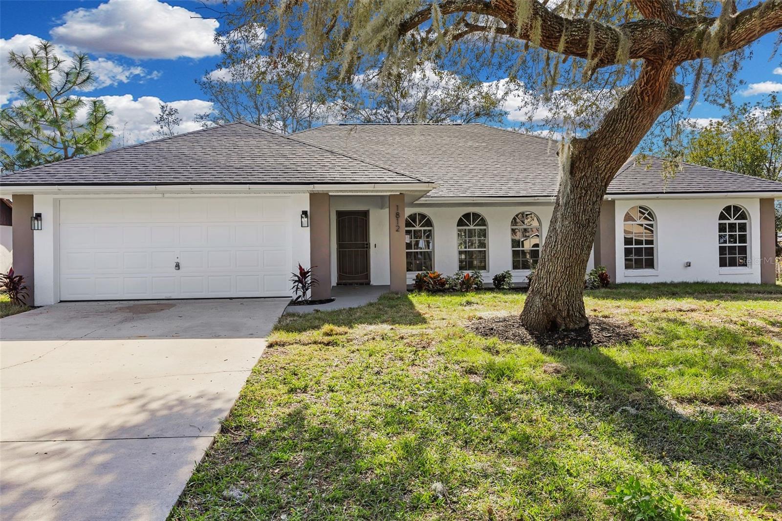 Discover the perfect blend of style and functionality in this beautifully and fully remodeled 3-bedroom, 2-bathroom home nestled on a generous 0.23-acre lot in the heart of Deltona. From the moment you step inside, you'll notice the attention to detail that sets this home apart.
The open floor plan creates a seamless flow throughout the spacious 1,910 sq ft of living space, anchored by brand-new waterproof luxury vinyl plank flooring that combines stunning aesthetics with everyday durability. The expansive great room is perfect for both relaxing evenings and lively gatherings, while natural light pours in to highlight every thoughtful upgrade.
The updated kitchen is a true showstopper, featuring modern finishes and plenty of counter space to satisfy any home chef. Retreat to the luxurious master suite, complete with dual sinks and a spa-like bathroom designed for ultimate comfort and relaxation. The split floor plan ensures privacy for all, with two additional well-appointed bedrooms ideal for family, guests, or a home office.
Step outside and enjoy the huge covered back porch — an entertainer's dream and the ideal spot to sip your morning coffee or host weekend barbecues while enjoying the Florida breeze.
Additional highlights include no HOA, a well-maintained lot with mature surroundings, and a prime Deltona location close to schools, shopping, dining, and easy access to I-4 for convenient commutes to Orlando or Daytona Beach.
This move-in ready gem won't last long — schedule your private showing today!