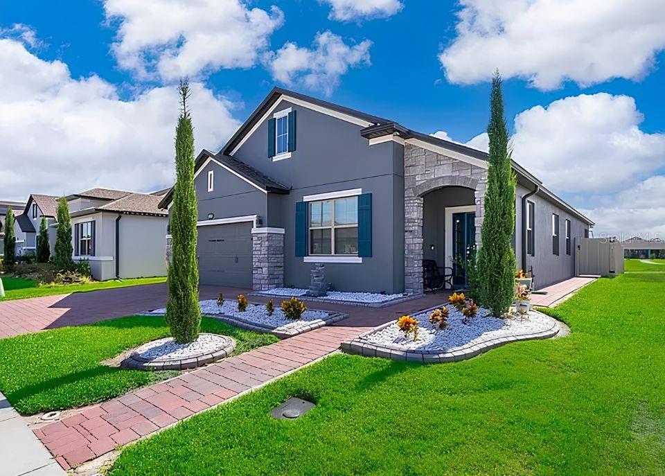 Available July 28th. This 4-bedroom, 2-bathroom home with a flex room features an open-concept floor plan, granite countertops, stainless steel appliances, and a whole-house water filtration system with an additional filtration unit at the kitchen sink. The property includes a fenced patio with lake views and convenient access to the community pool via a nearby pathway. Community amenities include a swimming pool and playground. Conveniently located near Lake Nona Town Center, Nemours Hospital, Orlando VA Medical Center, Orlando International Airport, major roadways, shopping, dining, and recreational opportunities. Approximately 20 minutes from the Nona West shopping district. No pets.