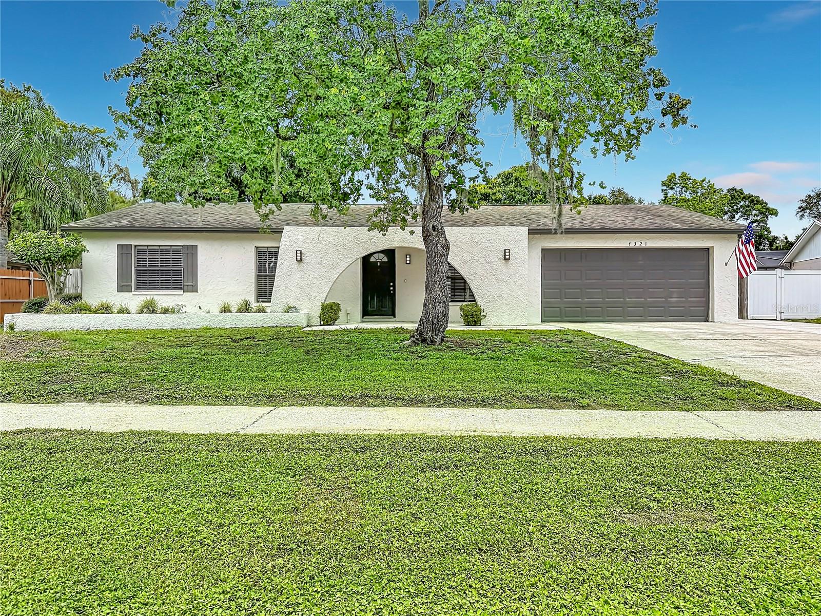 One or more photo(s) has been virtually staged. Discover your perfect retreat at 4321 Foxglen Lane in the desirable Northdale community of Tampa, FL 33624. This charming one-story pool home offers 3 bedrooms, 2 full bathrooms, and an attached 2-car garage, providing comfortable, low-maintenance living in a prime location.
Inside, you'll love the warm wood-look laminate flooring that flows throughout the home, creating a bright and inviting atmosphere. The tastefully updated kitchen is a standout, featuring modern stainless steel appliances and stylish finishes perfect for everyday meals or entertaining. Both bathrooms have also been refreshed, offering contemporary comfort and convenience.
Step outside to enjoy Florida living at its best. The spacious rear yard is fully fenced for privacy and features a beautiful in-ground pool. A covered and screened patio overlooks this serene outdoor space, making it an ideal spot for morning coffee, evening relaxation, or weekend gatherings with family and friends.  2008 Roof and 2022 Water Heater.  Northdale is a welcoming, family-oriented community known for its abundant amenities and suburban charm. Residents enjoy access to Northdale Park and Recreation Center, which includes basketball and tennis courts, a fitness room, paved trails, playgrounds, a splash pad, picnic shelters, and an indoor gym. The area also features excellent parks, walking trails, and recreational options, along with proximity to a championship golf course and tennis facilities at the Northdale Golf & Tennis Club. Shopping, dining, and everyday conveniences are just minutes away along Dale Mabry Highway.
You'll be conveniently located within 20 miles of Tampa's top attractions. Head to Busch Gardens and Adventure Island for thrilling rides and animal encounters (roughly 8-12 miles away), or visit ZooTampa at Lowry Park for family-friendly wildlife adventures. Downtown Tampa and the scenic Tampa Riverwalk offer dining, entertainment, museums like the Florida Aquarium, and vibrant cultural experiences. Tampa International Airport is an easy drive, while beautiful Gulf beaches (such as those in Clearwater or St. Pete) are within a short 30-45 minute reach. Nature lovers can explore nearby preserves and parks for hiking, paddling, and outdoor recreation.
This well-maintained pool home in Northdale combines modern updates, comfortable living spaces, and an unbeatable location for an active Florida lifestyle.