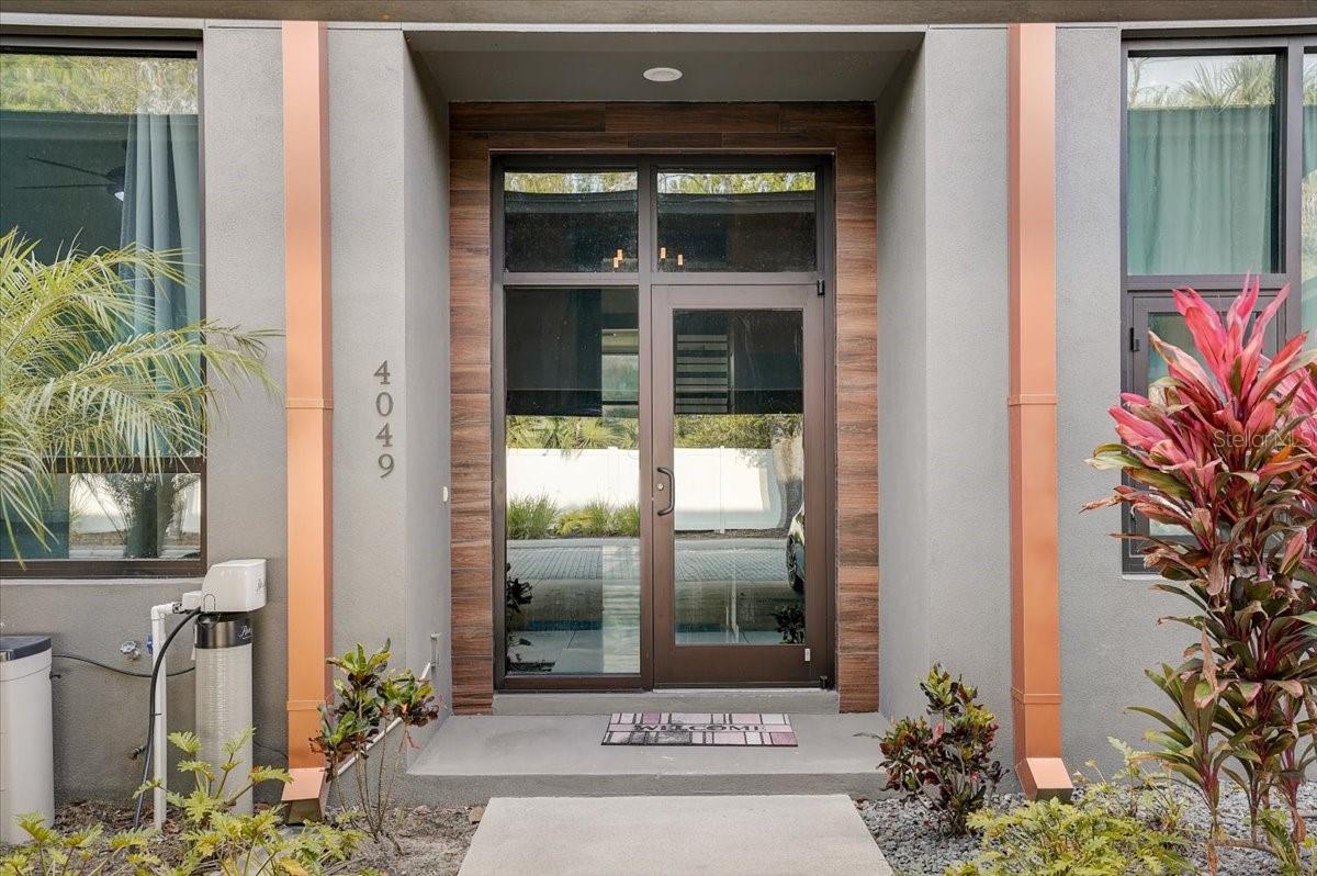 Welcome to your dream home in the heart of Tampa/Carrollwood! This modern and stylish 3-bedroom, 3-bathroom townhouse boasts a spacious rooftop space and a deck, perfect for relaxing and entertaining with family and friends. As you step into this beautifully designed townhouse, you'll immediately notice the elegant concrete flooring of the home. The laundry closet is conveniently located upstairs for easy access. The master bedroom upstairs features a spacious walk-in closet and an ensuite bath complete with his and her sinks, toilet, and walk-in shower, perfect for unwinding after a long day. One bedroom downstairs also has its own ensuite bath, making it ideal for accommodating guests or family members. The kitchen features solid wood cabinets, ample storage, granite counters, and a breakfast bar. The living room is the perfect space to relax and unwind, with a beautiful view of the lake and quick access to the deck. This gated community provides two assigned parking spots in front of the unit for your convenience. You'll enjoy breathtaking lake views from the comfort of your own home. Built in 2019, this property is in pristine condition and ready for you to move in! The HOA fee includes access to the community pool, maintenance of the exterior, grounds, repairs, and trash. Located just off Dale Mabry Highway and the Veterans Express Highway, this property offers easy access to Tampa International Airport, Raymond James Stadium, and the International Mall. You'll love the convenience of living in the heart of Tampa/Carrollwood while still enjoying the peace and tranquility of this beautiful townhouse. Don't miss out on this incredible opportunity to make this stunning property your own!