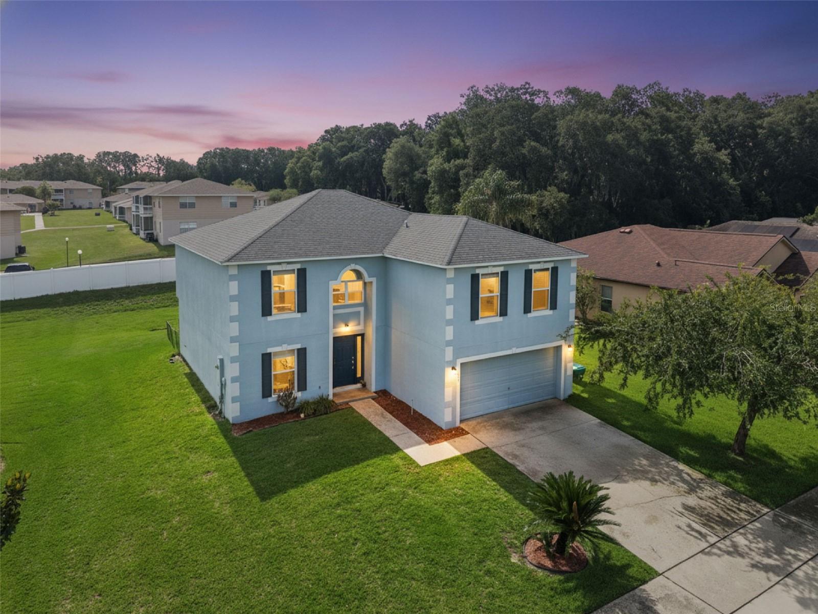 Experience elevated living in the gated WATERFRONT community of Lakeview Reserve, ideally situated in the heart of historic downtown Winter Garden in the GOLF CART DISTRICT with LOW HOA. This impressive FIVE-bedroom, THREE-bath residence with dining space and LOFT offers an exceptional combination of space, comfort, and versatility, thoughtfully designed to accommodate both everyday living and grand-scale entertaining. Boasting a generous floor plan with expansive living areas and well-proportioned bedrooms, the home provides ample room for growing families, multigenerational living, or those seeking dedicated spaces for a home office, fitness room, or media retreat. Situated on a premium homesite spanning nearly one-quarter of an acre (.19), the property presents endless possibilities for outdoor enjoyment. Whether you envision creating a private backyard oasis, adding a custom pool, designing an outdoor kitchen, or simply enjoying the abundance of open green space, this oversized lot offers the flexibility to bring your vision to life while still providing plenty of room for recreation and relaxation. Upon entering, you are welcomed by a thoughtfully designed open-concept floor plan enhanced by new flooring and a freshly painted interior (2023-2024), creating a bright and inviting atmosphere throughout. The beautifully appointed and newly UPDATED gourmet kitchen serves as the heart of the home, featuring stainless-steel appliances, quartz countertops, shaker style cabinets, and two pantries. The living area is adjacent to the kitchen and presents a great opportunity to expand into the outdoor space creating an indoor-outdoor vibe. Designed with flexibility and comfort in mind, the main level offers a generously sized guest bedroom and a full bathroom, ideal for visitors, a home office, or multigenerational living.  The laundry room and dining space are also located on the main level. Upstairs, the spacious primary suite provides a private retreat, while three additional bedrooms, full bath, and loft offer abundant space for family and guests. The primary suite includes a garden tub with separate shower, vanity, linen closet, and walk-in closet. Enjoy picturesque views of Lake Apopka from multiple vantage points throughout the home, creating a serene backdrop for everyday living. ADDITIONAL UPDATES: roof (2018), water heater (2025), downstairs AC (2024-2025), Just moments away, residents enjoy exclusive access to a private community dock overlooking the lake—an idyllic setting for morning coffee, fishing, or taking in spectacular sunset views. Located within the golf-cart district, this remarkable home places you just minutes from the charming boutiques, acclaimed dining, farmers market, and year-round events that make downtown Winter Garden one of Central Florida’s most sought-after destinations. Convenient access to major highways (Turnpike, 429, East-West Expressway) further enhances the lifestyle, placing world-renowned attractions such as Walt Disney World, Universal, and downtown Orlando within easy reach. You can access the 22 mile long WEST ORANGE Trail just footsteps outside of the community to take in cycling and exercising. Move-in ready, this exceptional residence offers a rare opportunity to enjoy luxury, convenience, and a true sense of community in one of Winter Garden’s sought after gated neighborhoods. Measurements are approximate. Buyer is responsible for verifying information.